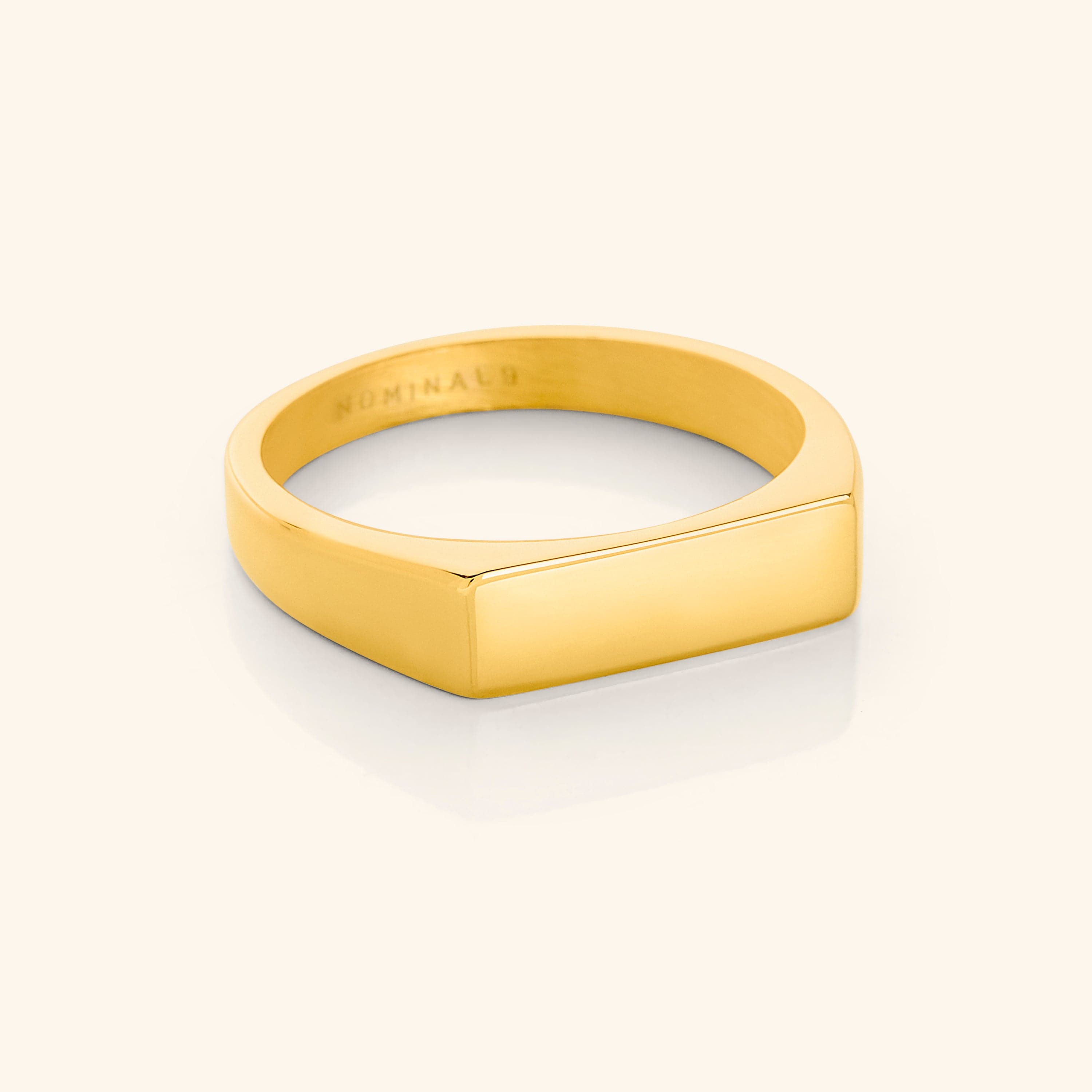 Elegant gold bar ring featuring a minimalist design, ideal for casual or formal settings.