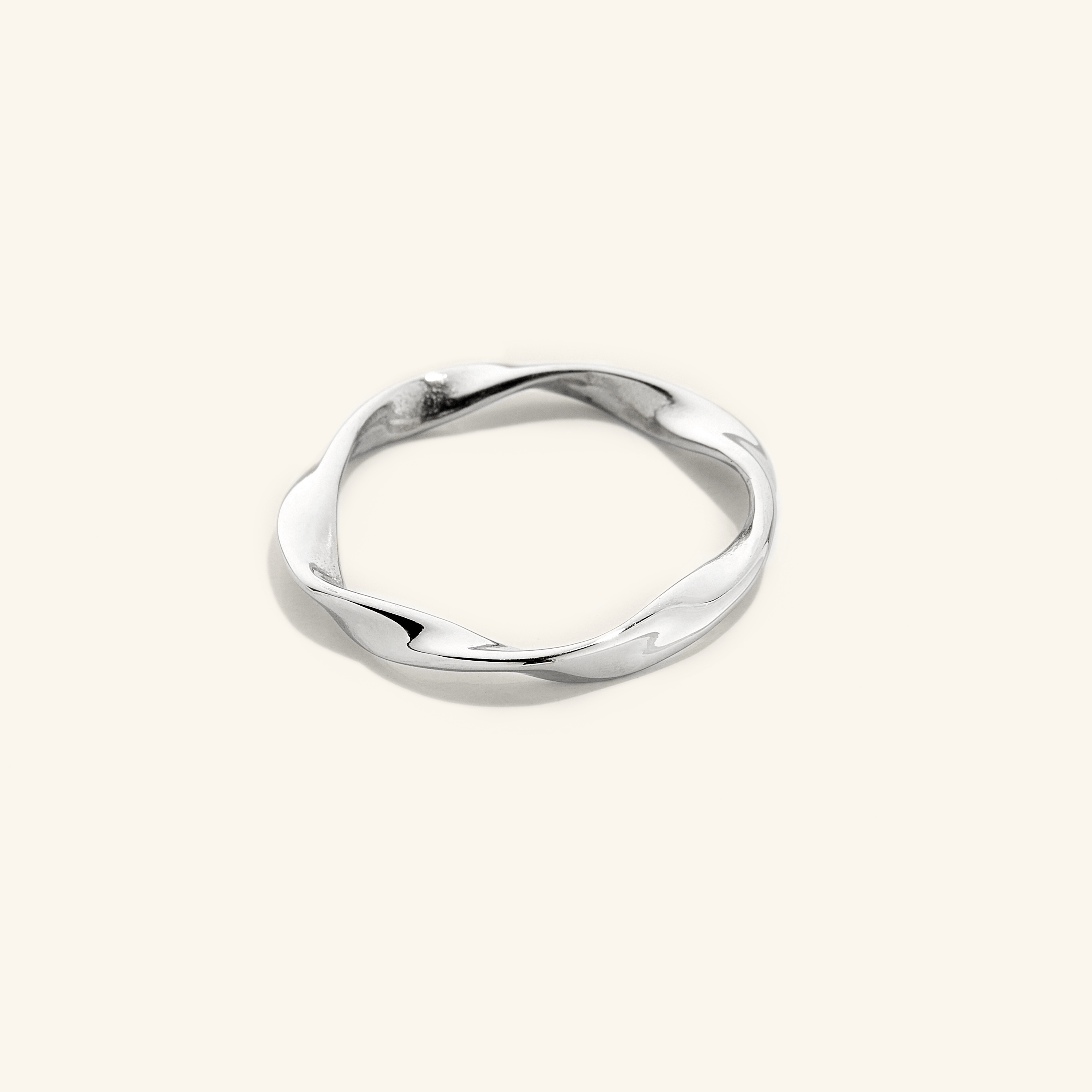 Close-up of the Ripple Effect Minimalist Gold Ring highlighting its 18k gold plating.