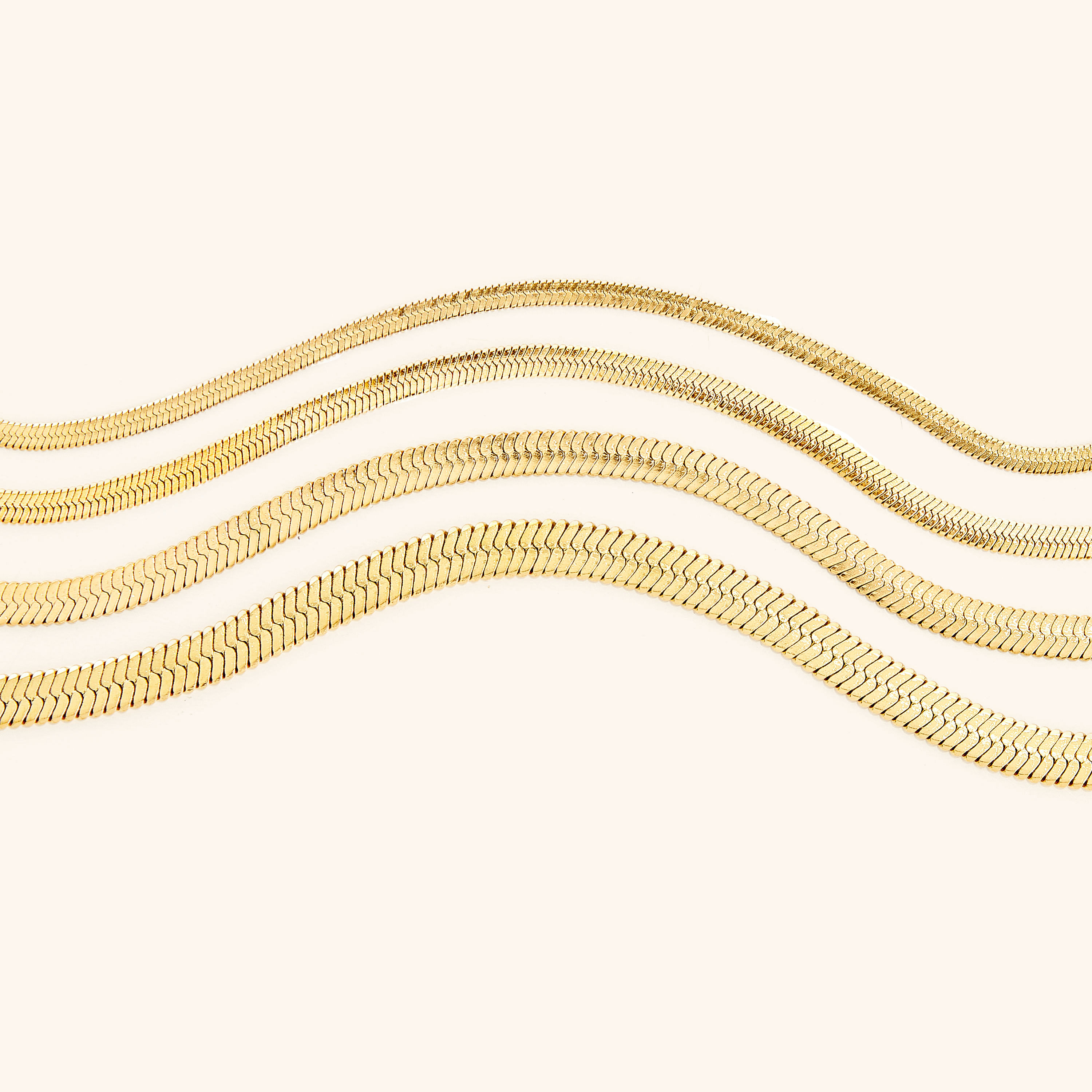 The herringbone bracelet in a velvet pouch, perfect for gifting or storage.