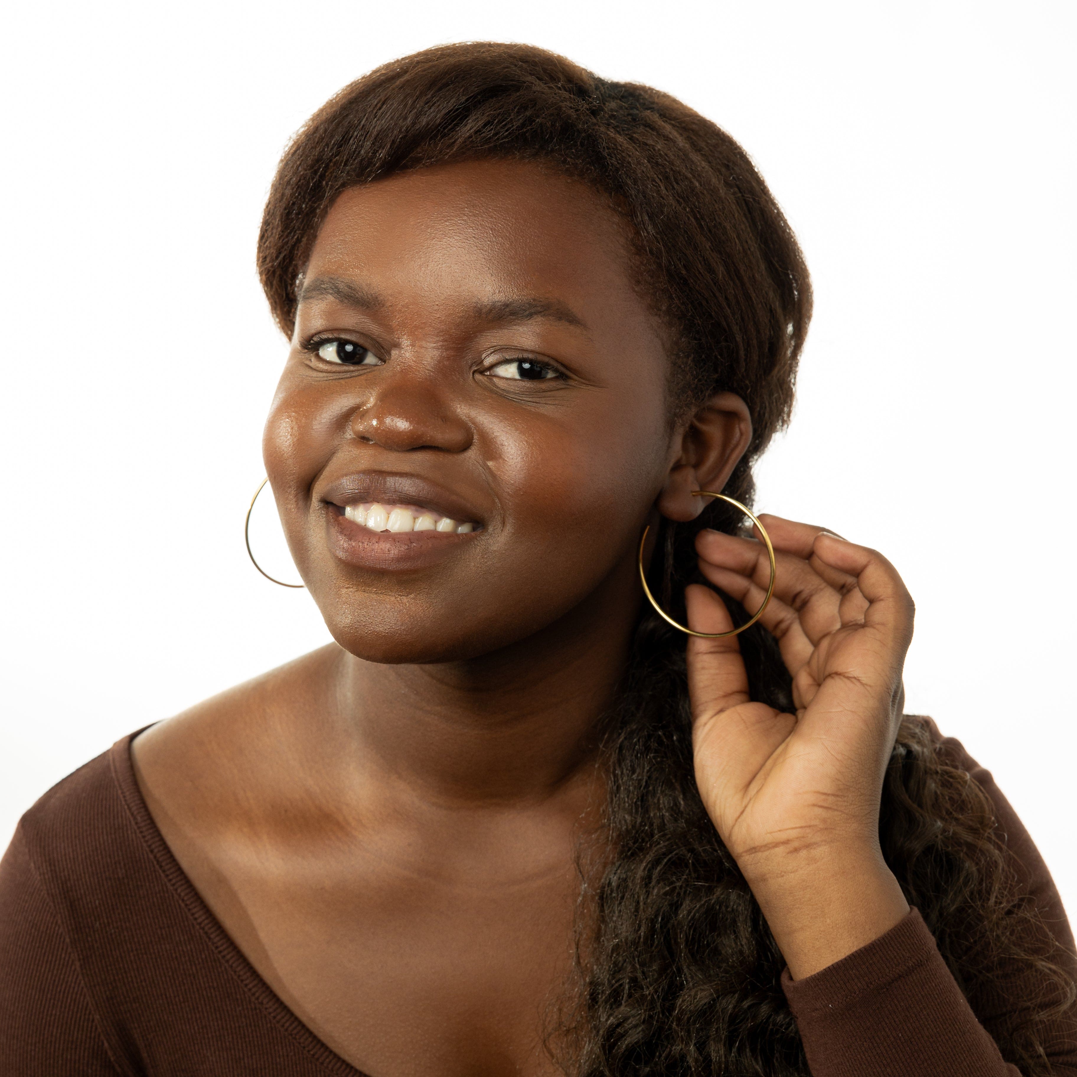 Lifestyle shot of women wearing trendy earring sets for women at a social event.