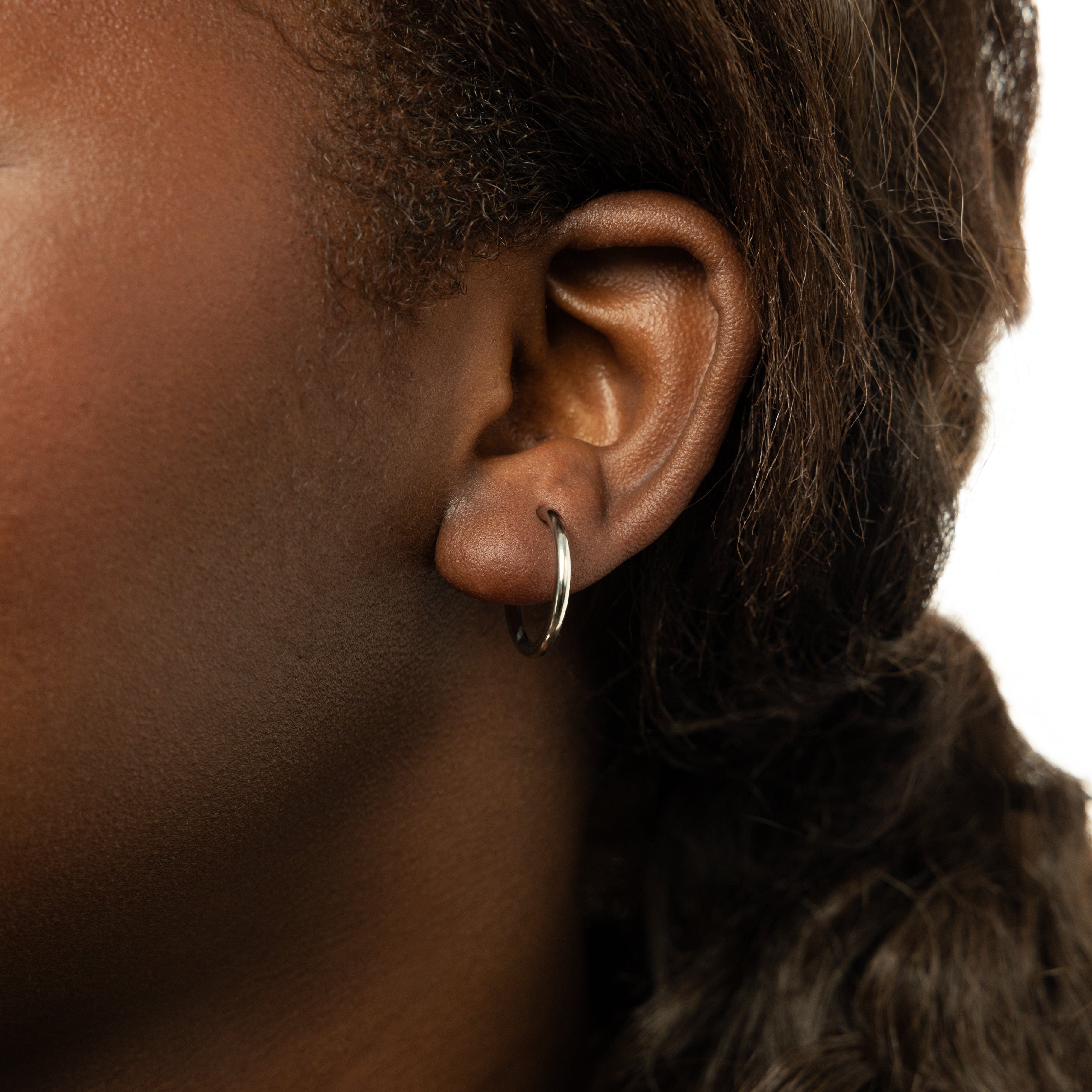 Close-up of the Essential Earring Set showcasing four pairs of stylish earrings.