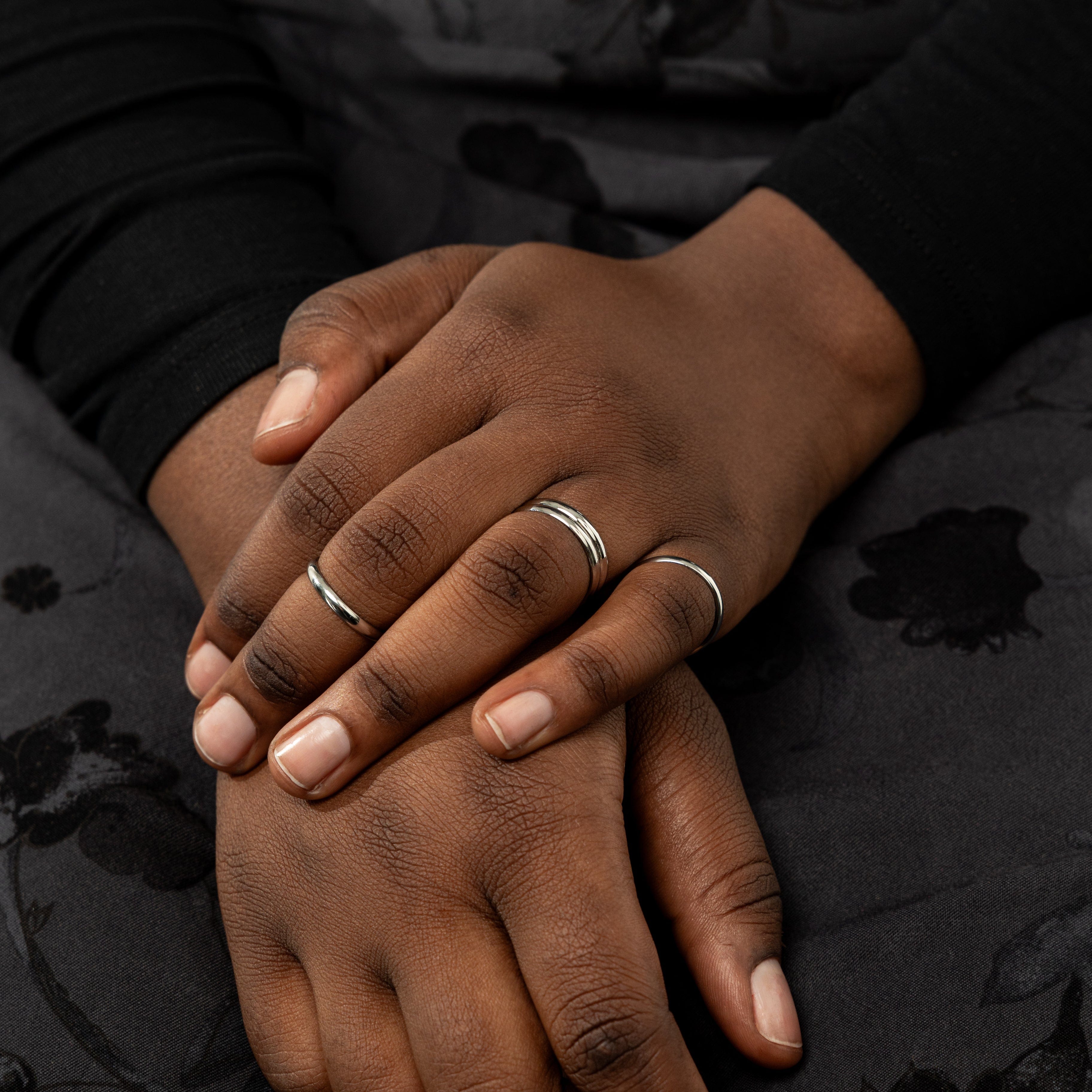 Timeless thin gold ring displayed with other stackable rings