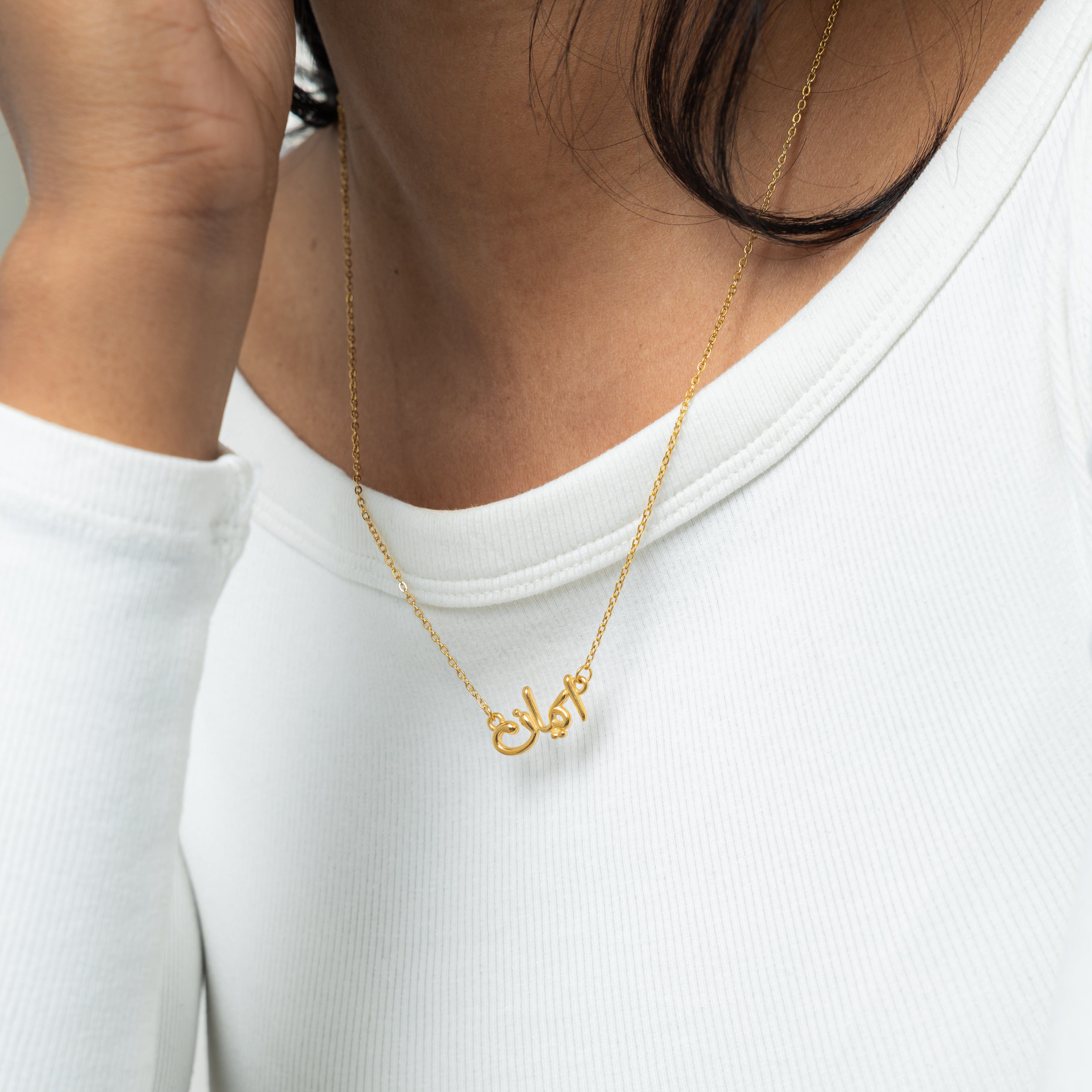 Faith necklace in its velvet pouch, showcasing the packaging for gifting.