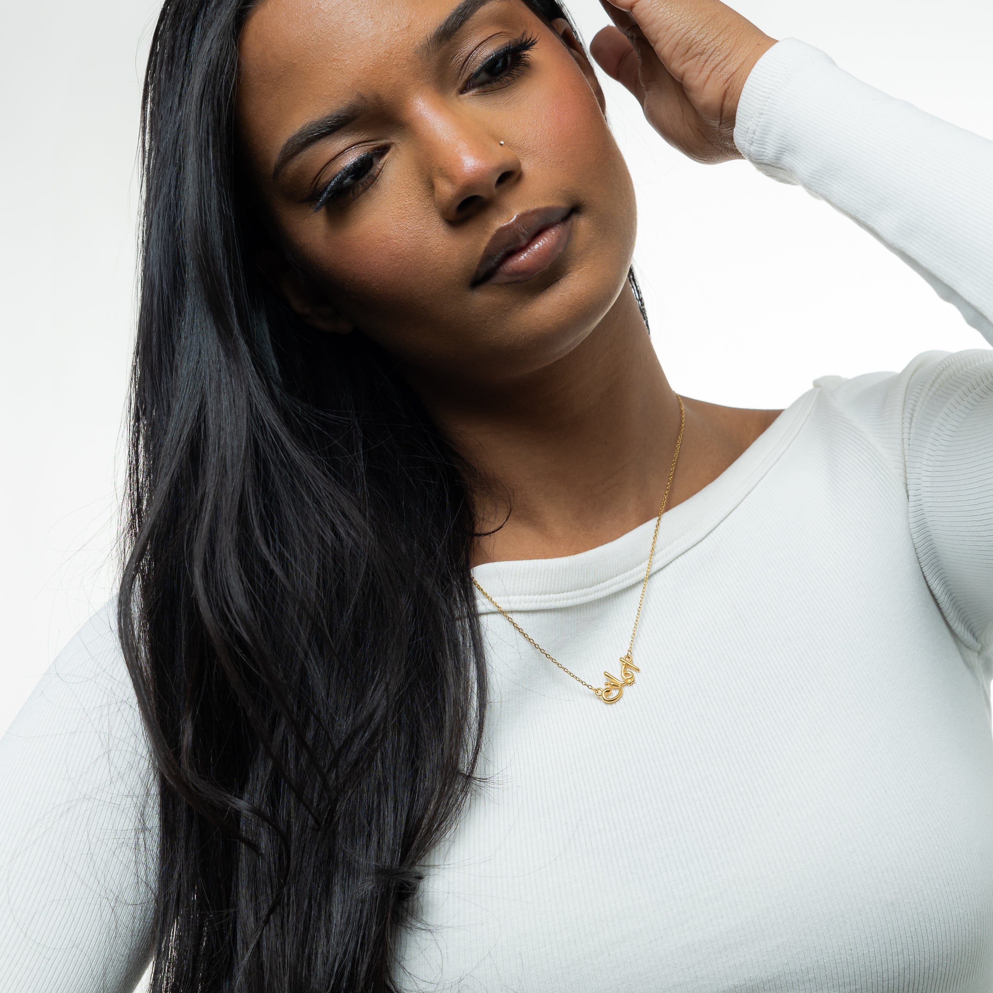 Faith bubble necklace displayed on a model, highlighting its elegant design and length.