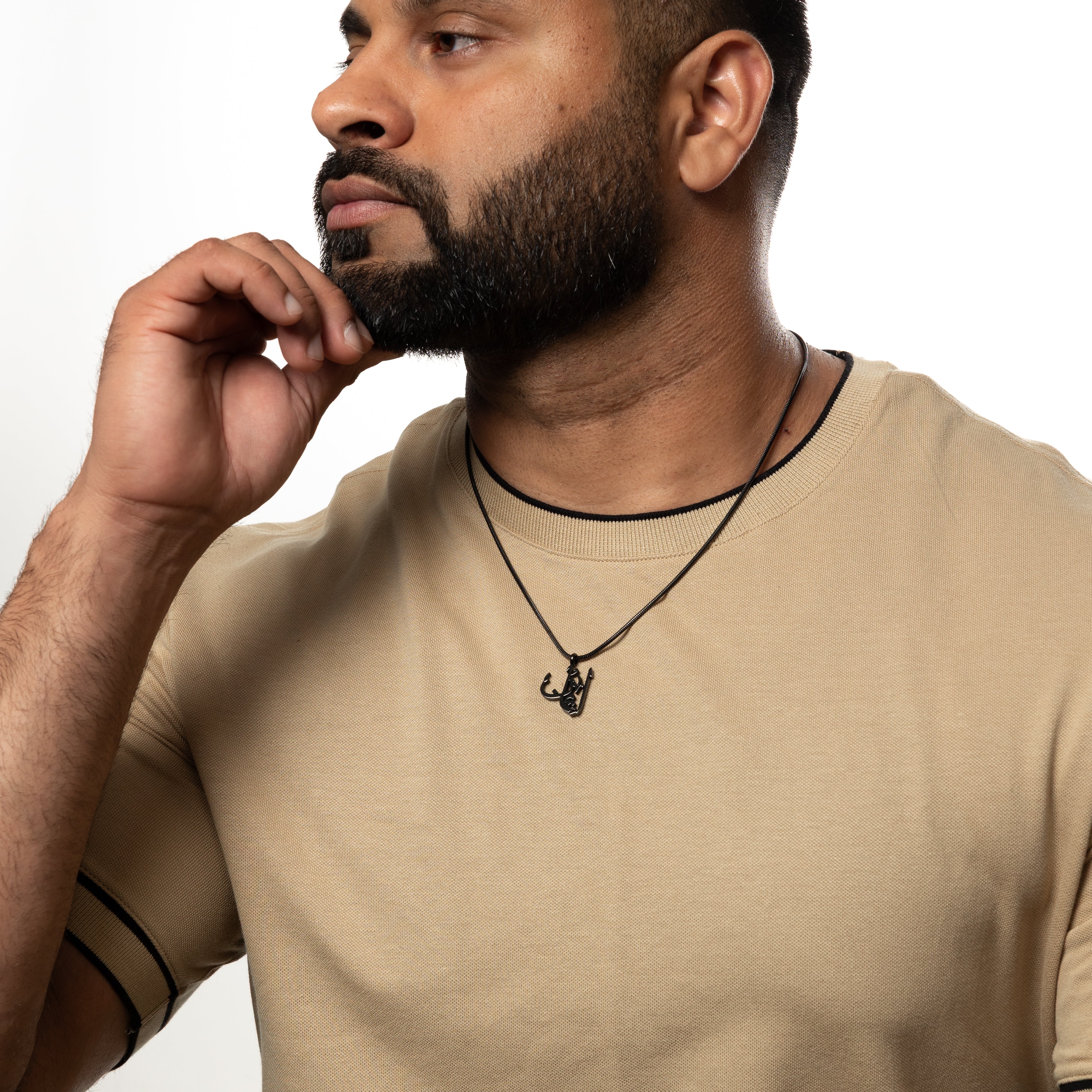 Timeless Faith Calligraphy Necklace worn by a man, highlighting its stylish appeal.