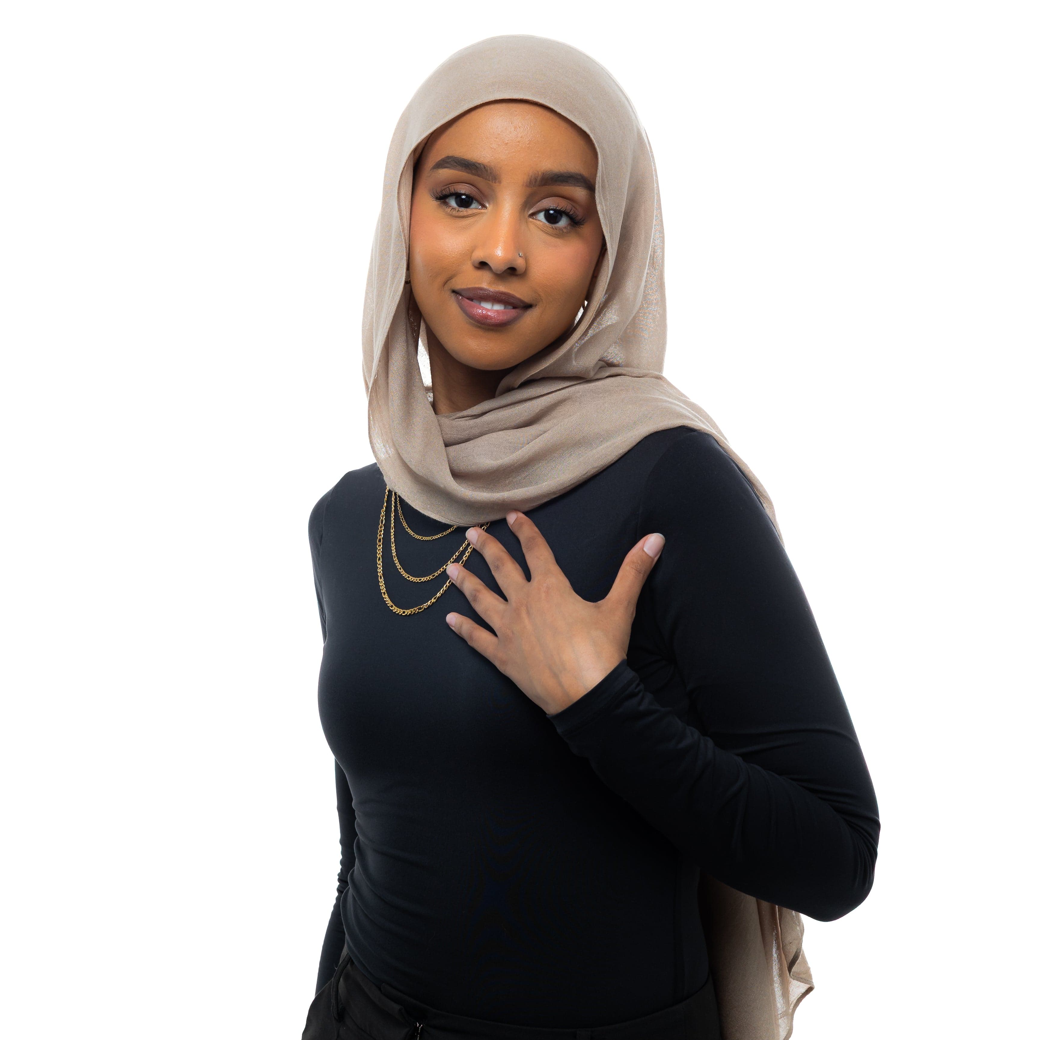 Model wearing the Figaro chain necklace, showcasing its versatility as a choker.