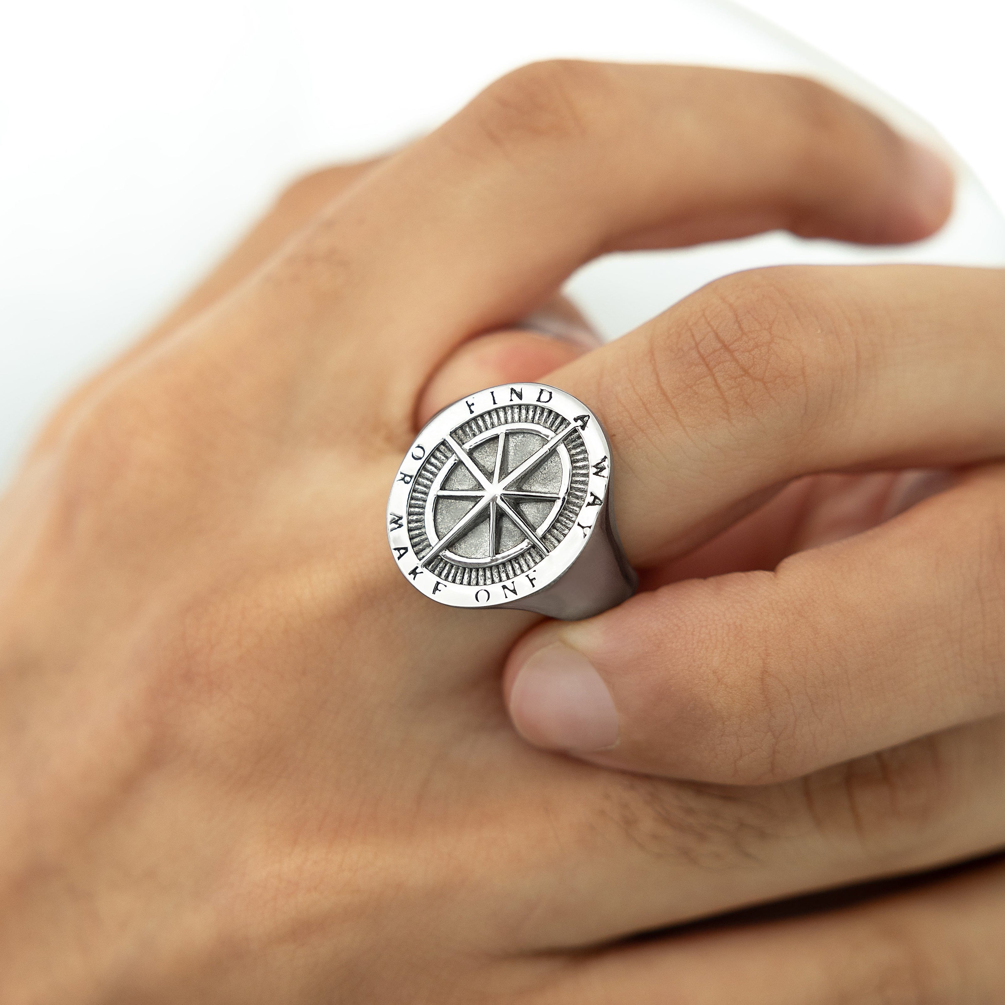 Lifestyle shot of a man wearing the compass ring, symbolizing adventure and motivation.