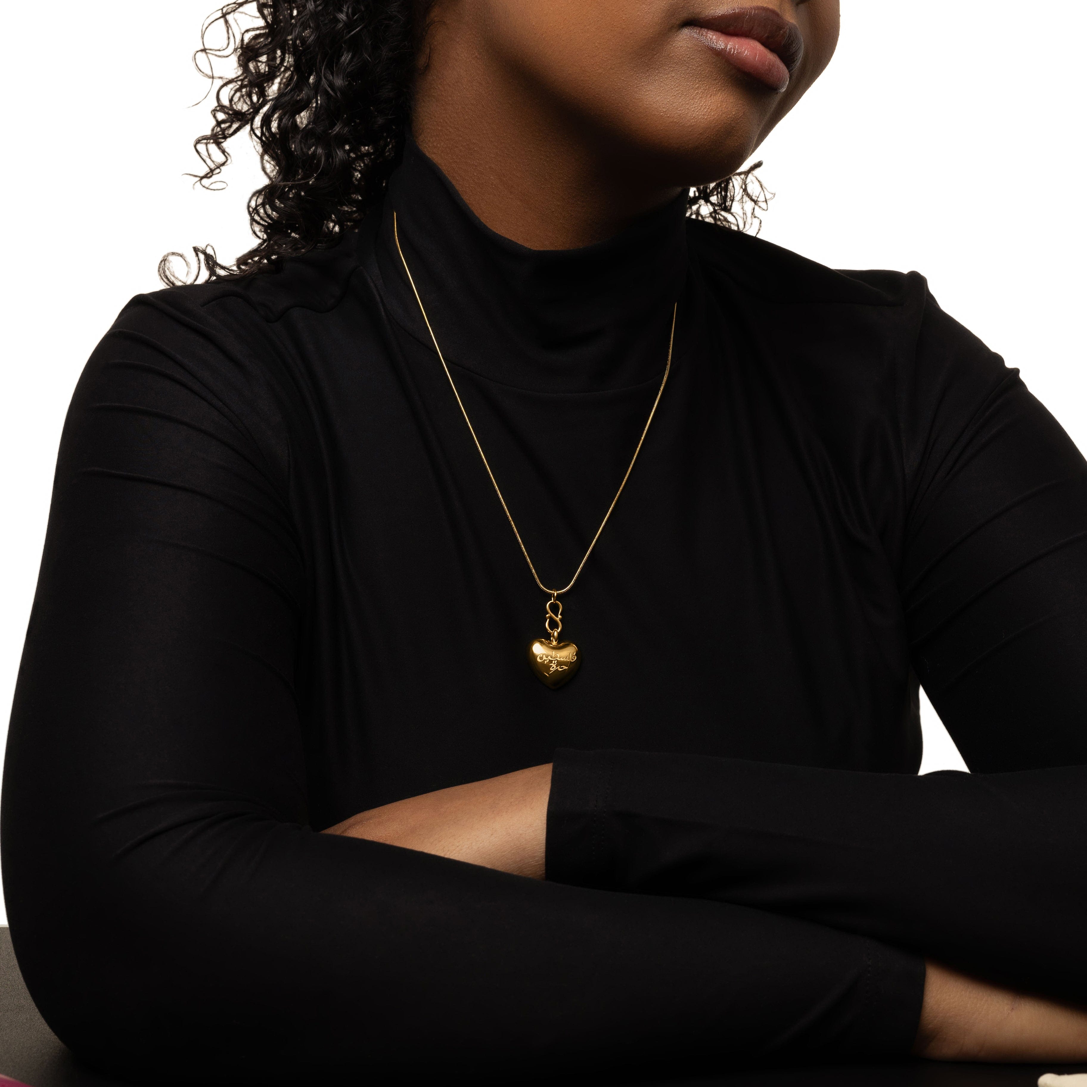 Solidarity heart necklace displayed on a velvet pouch, showcasing its elegant design.