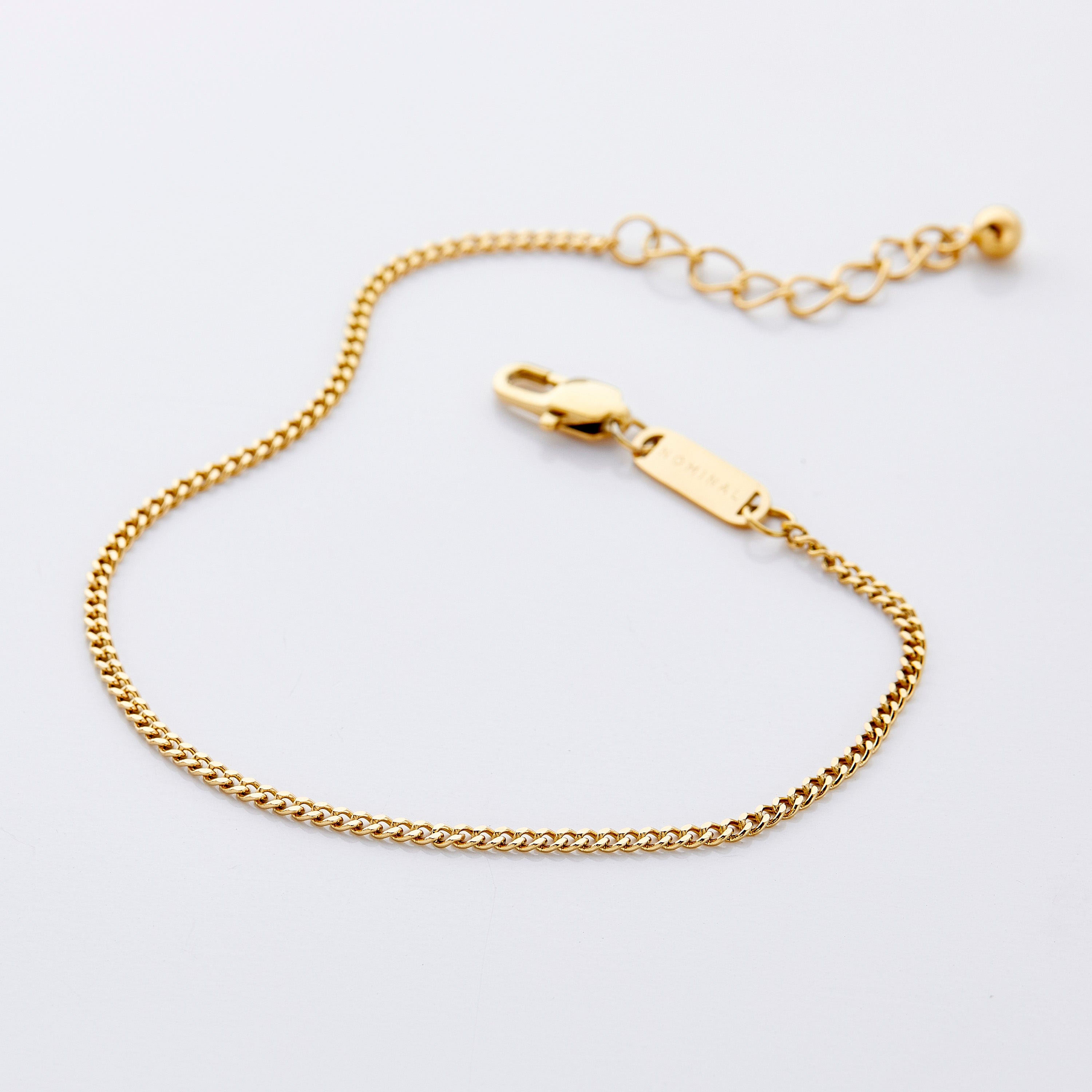 Close-up of the gold Cuban chain anklet showcasing its delicate links