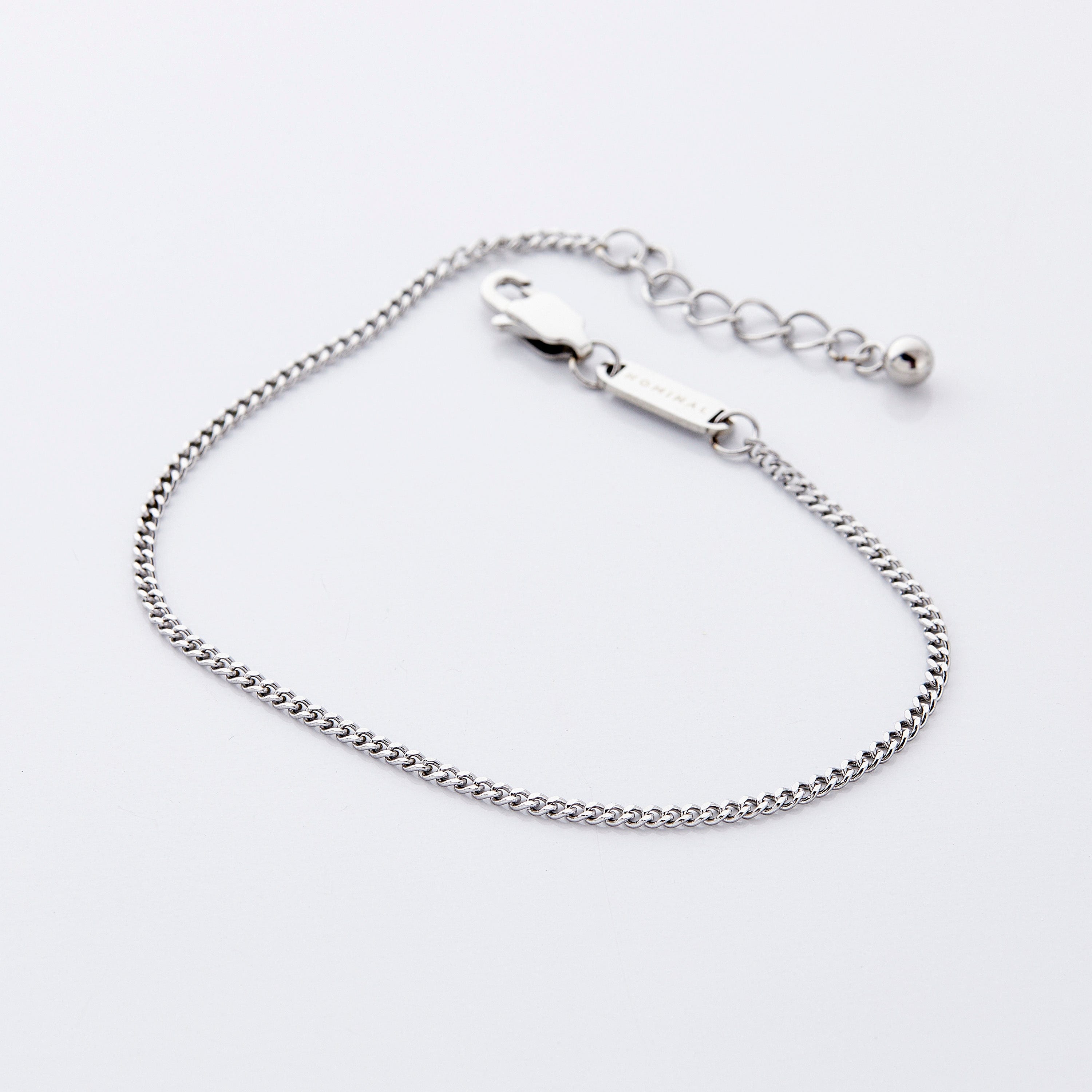 Close-up of the gold Cuban chain anklet showcasing its delicate links