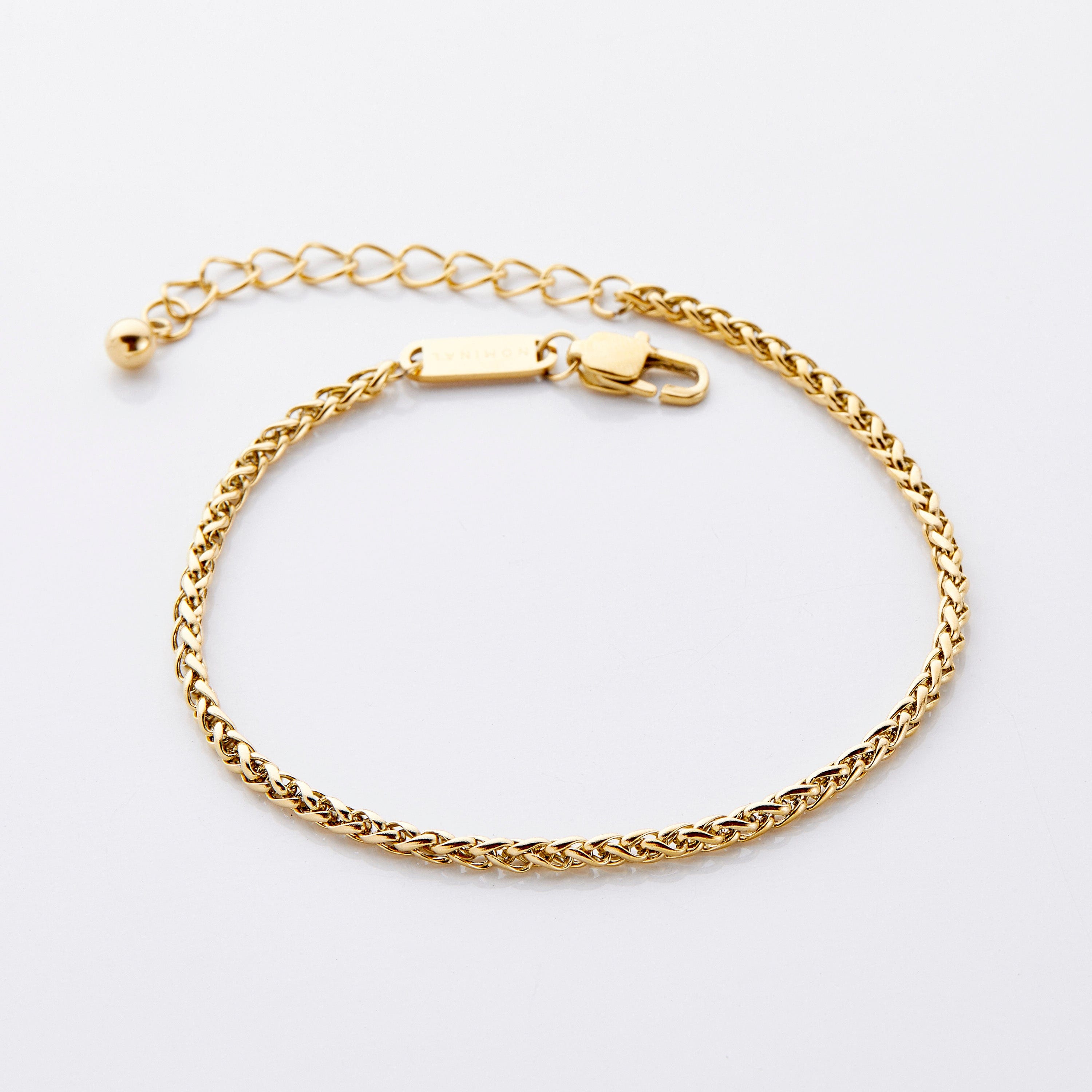 Elegant gold wheat chain anklet showcasing the intricate link design.