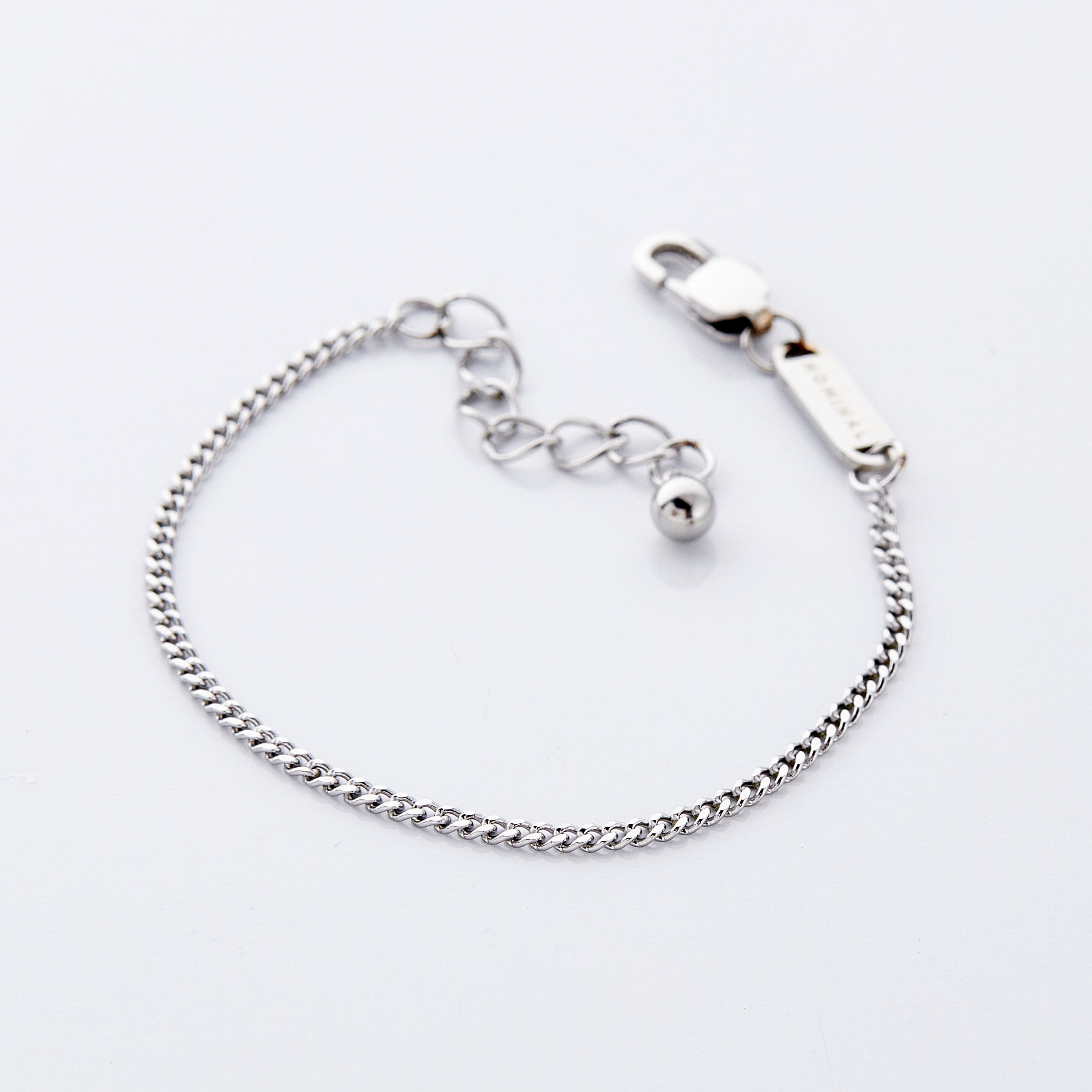 Elegant presentation of the Cuban chain bracelet in a velvet drawstring pouch.