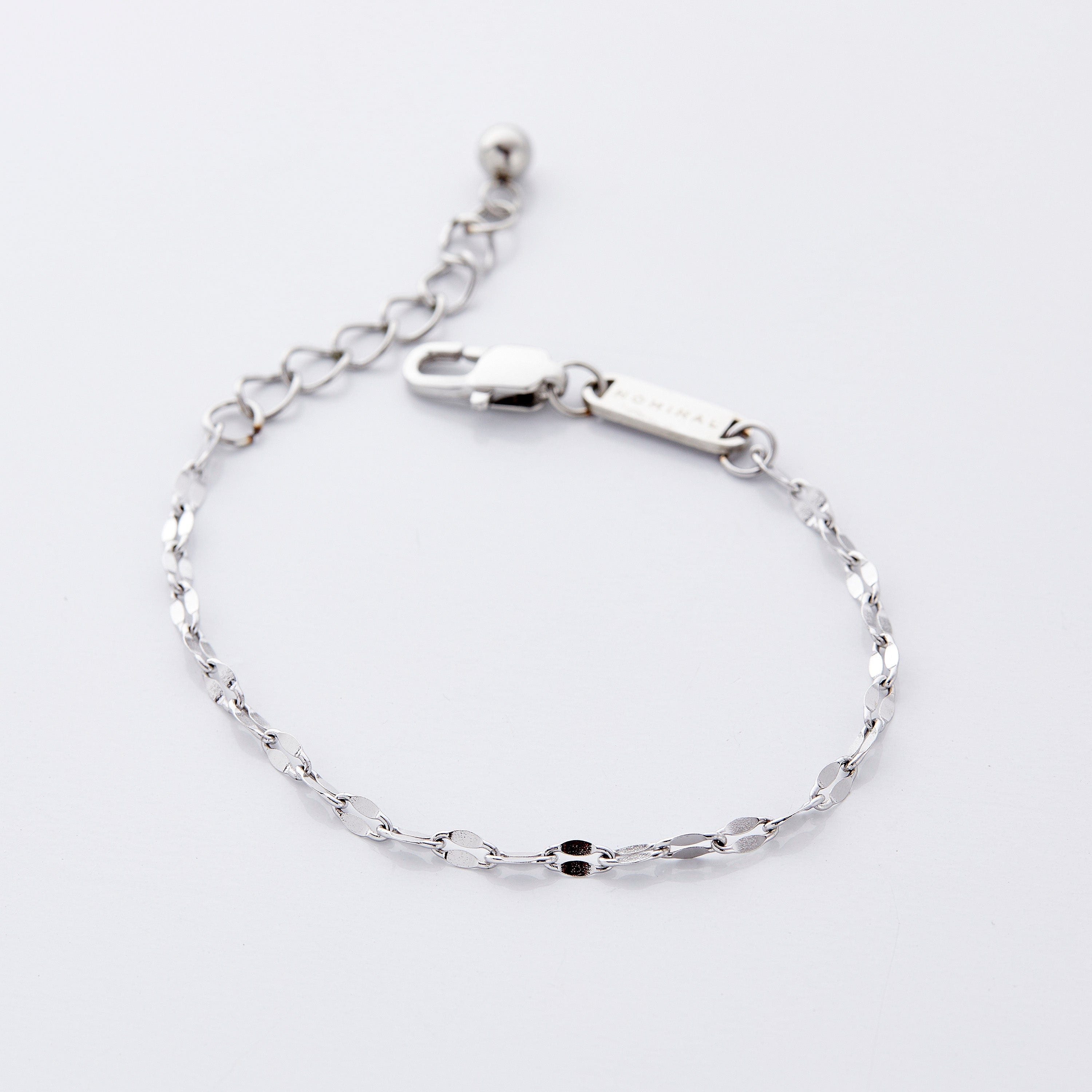 Display of the flutter chain bracelet in a velvet pouch, emphasizing its thoughtful packaging.