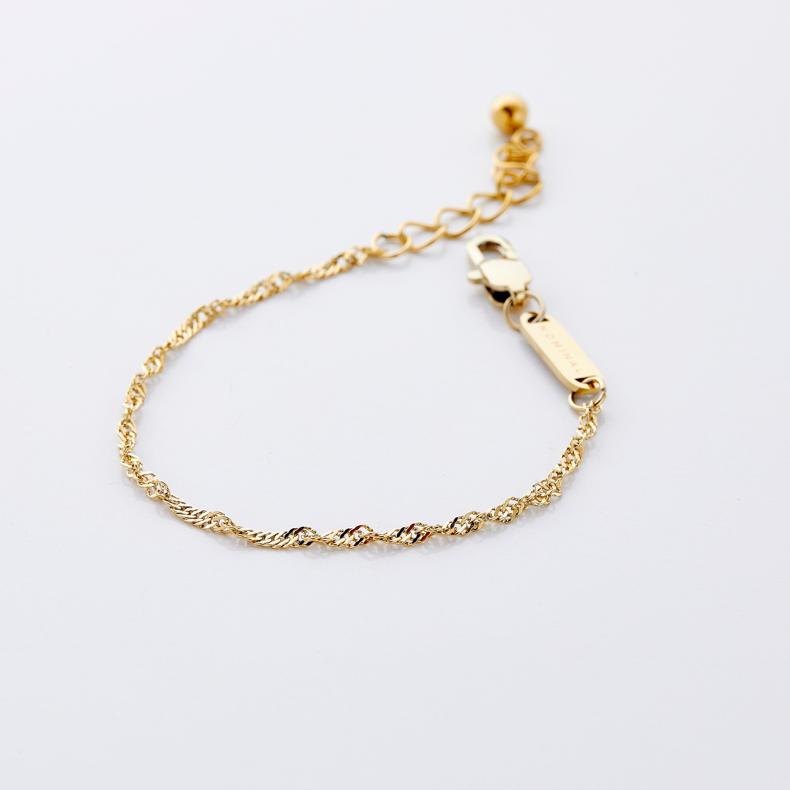 Close-up of the Glistening Twisted Gold Chain Bracelet showcasing its detailed oval links and shine.