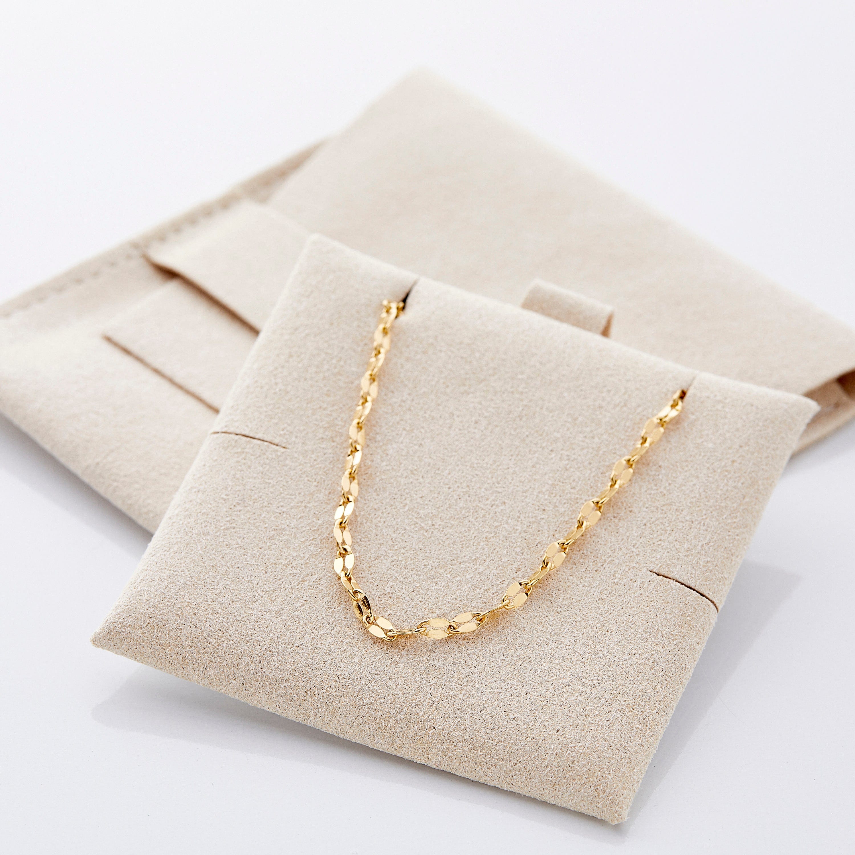 Silver flutter chain necklace elegantly styled with a casual outfit.