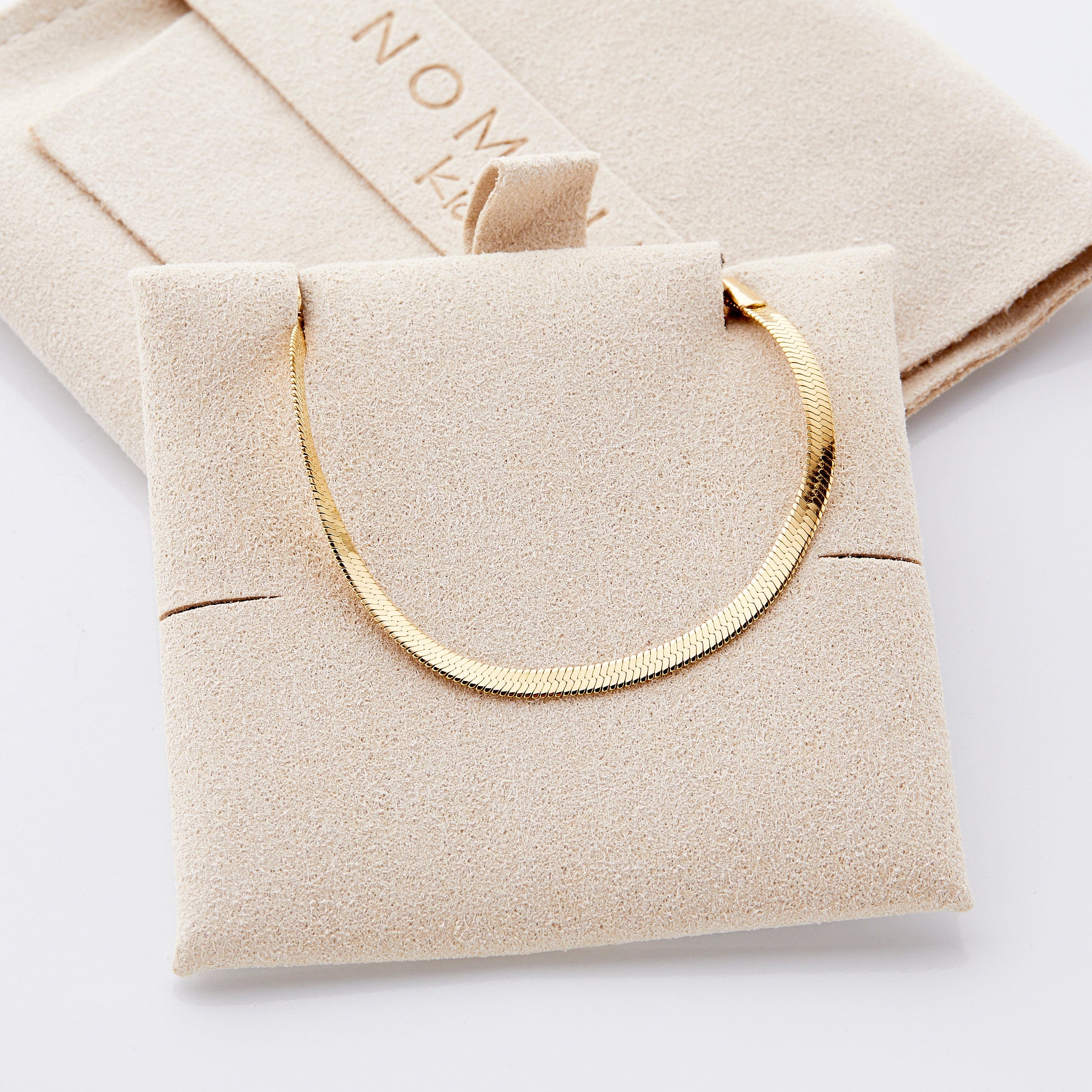 Liquid Gold Herringbone Chain Bracelet worn by a girl, highlighting its stylish appeal and comfort.