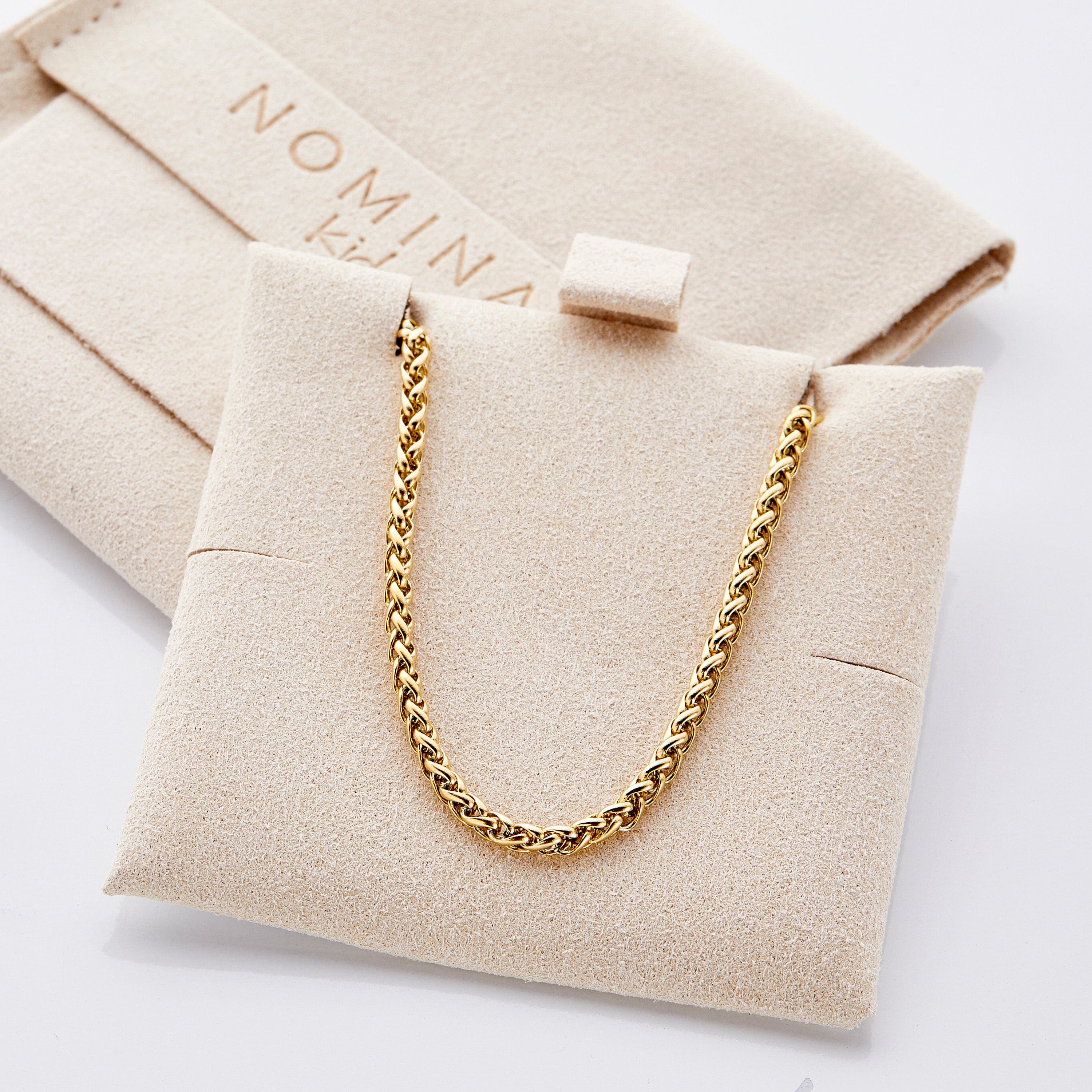 Close-up of the hypoallergenic gold chain necklace, highlighting its seamless links.