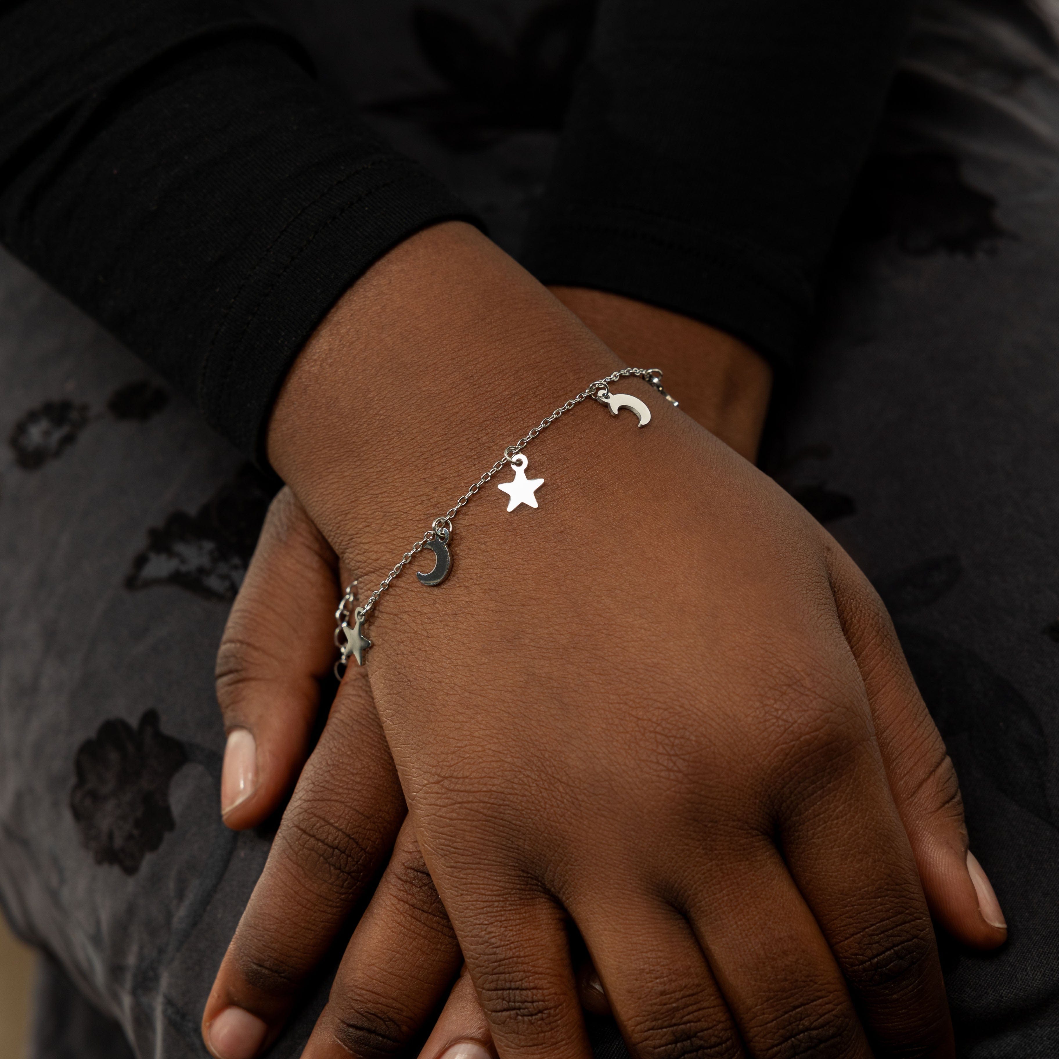Model wearing the Celestial Elegance Gold Bracelet, demonstrating its versatility with a casual outfit.