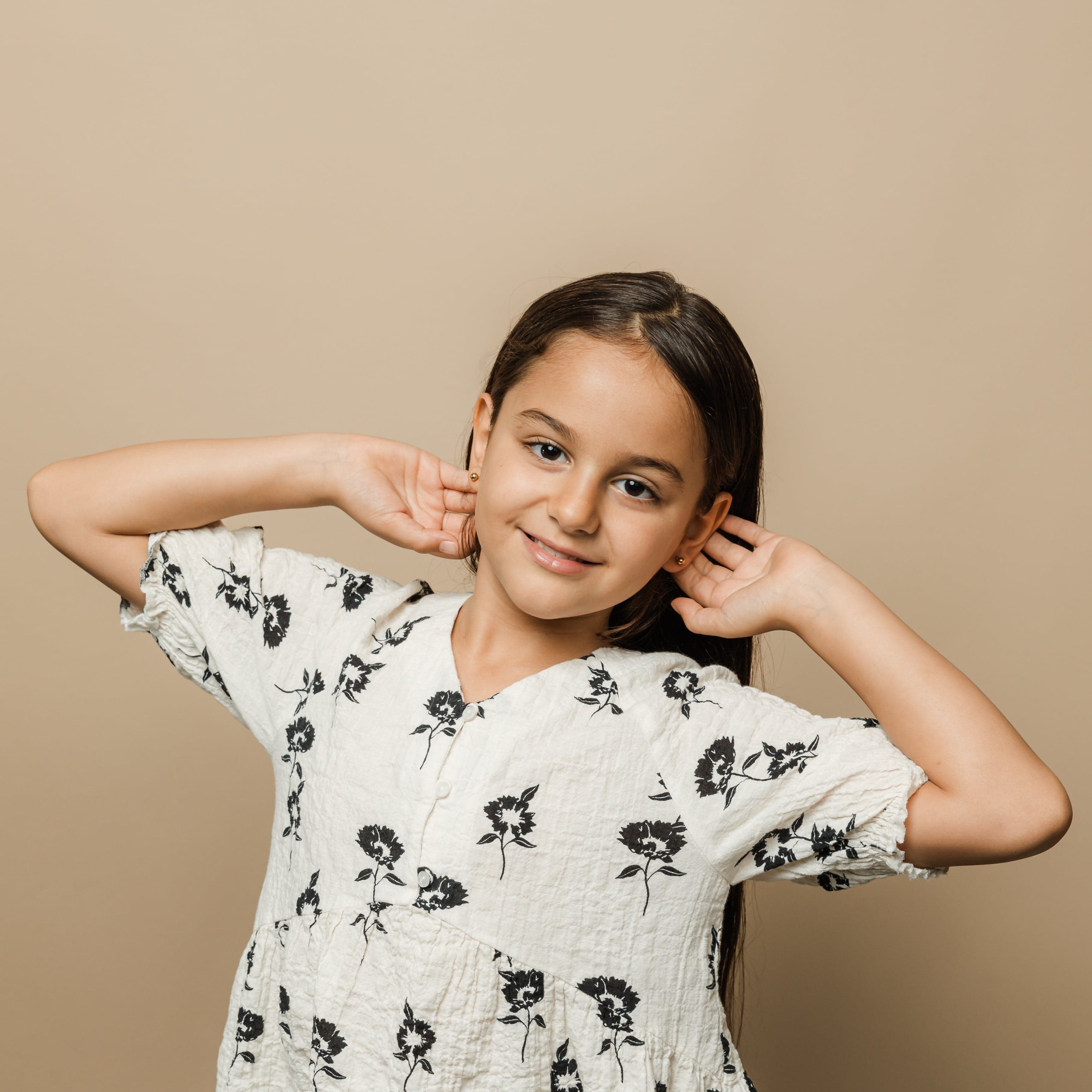 Timeless Gold Orb Earrings for kids showcased in a velvet pouch, highlighting their elegant design.