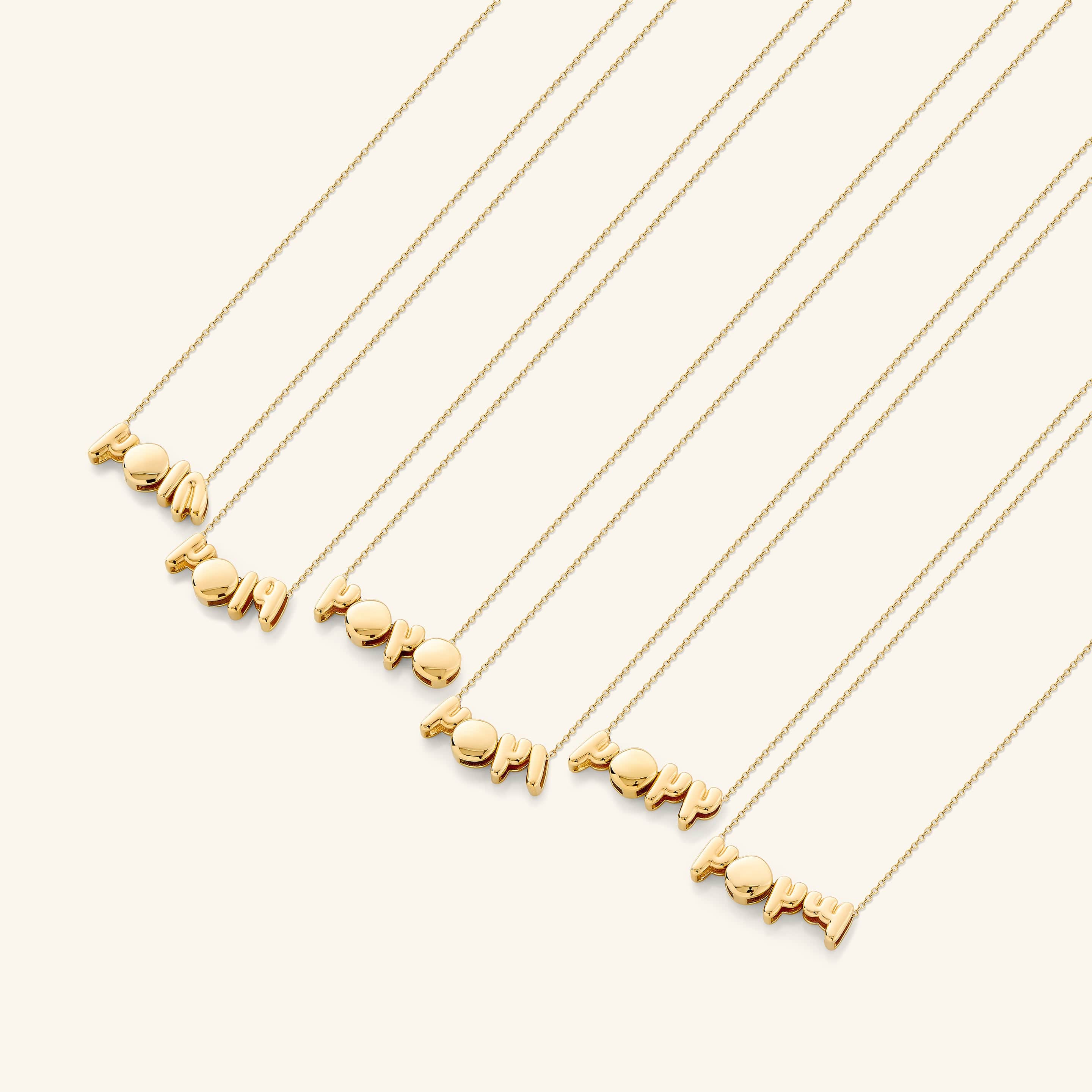 A woman wearing the Arabic birthyear necklace, emphasizing its stylish appeal and versatility.