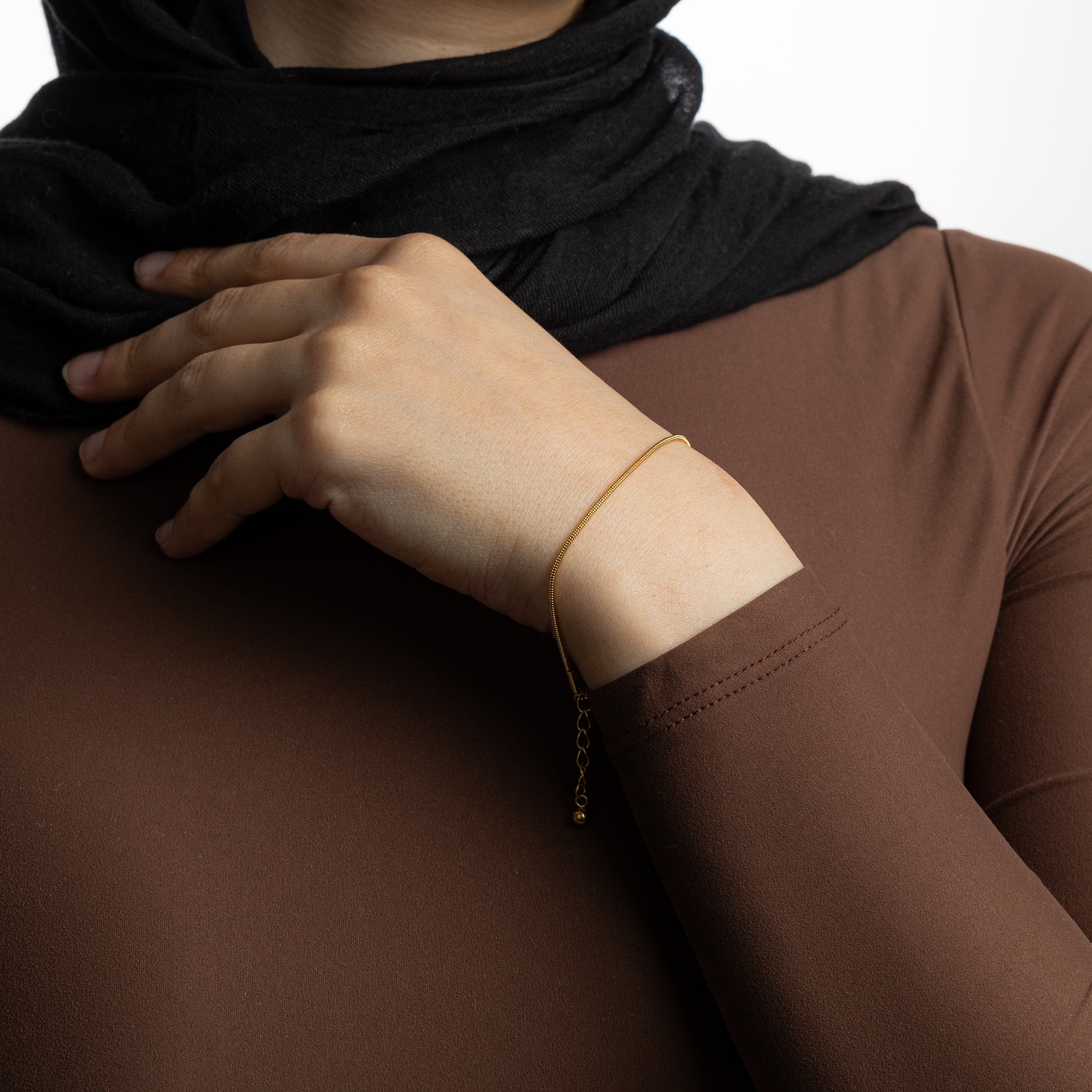 Stylishly displayed gold bracelet in a velvet pouch, ideal for gifting or personal use.