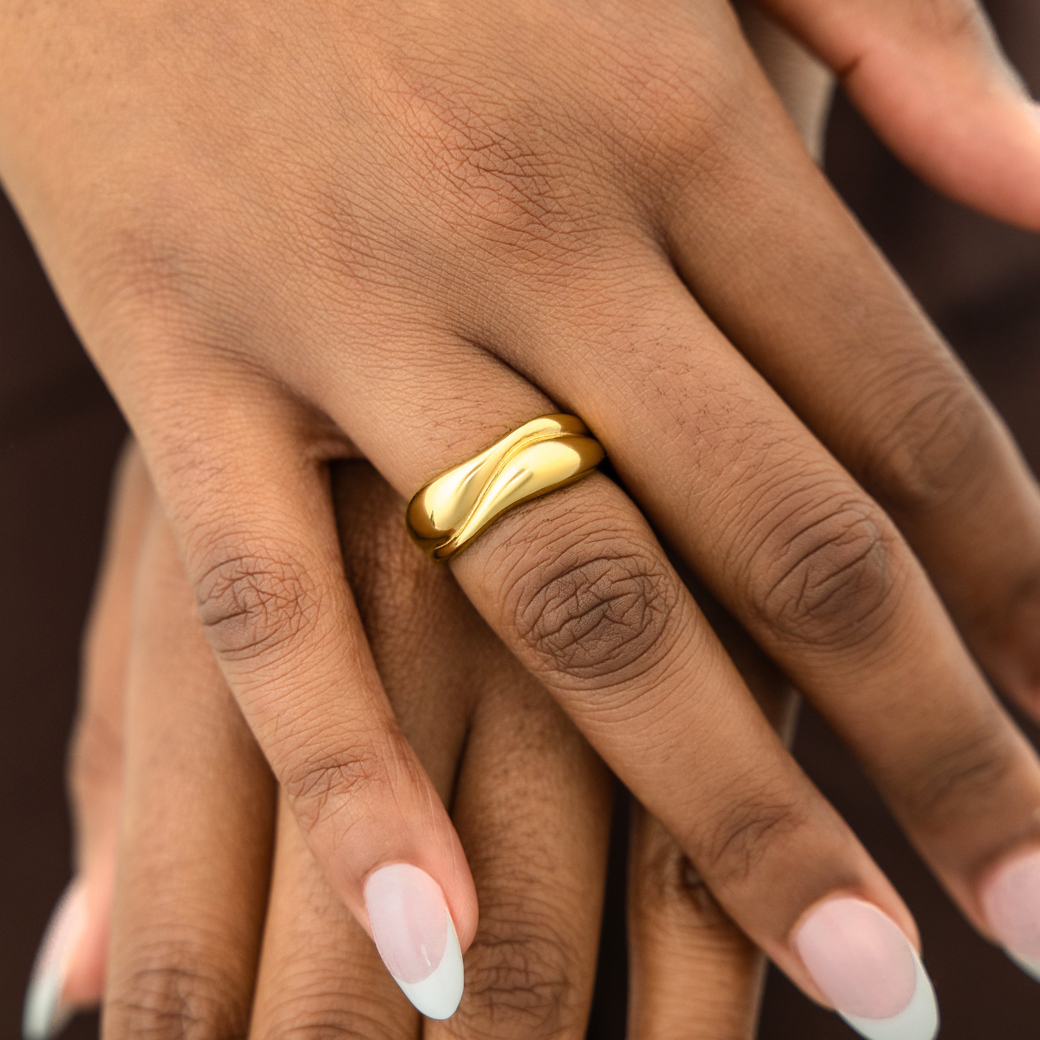 Close-up of the Fluid Harmony Stackable Rings intricate details and 18K gold plating.