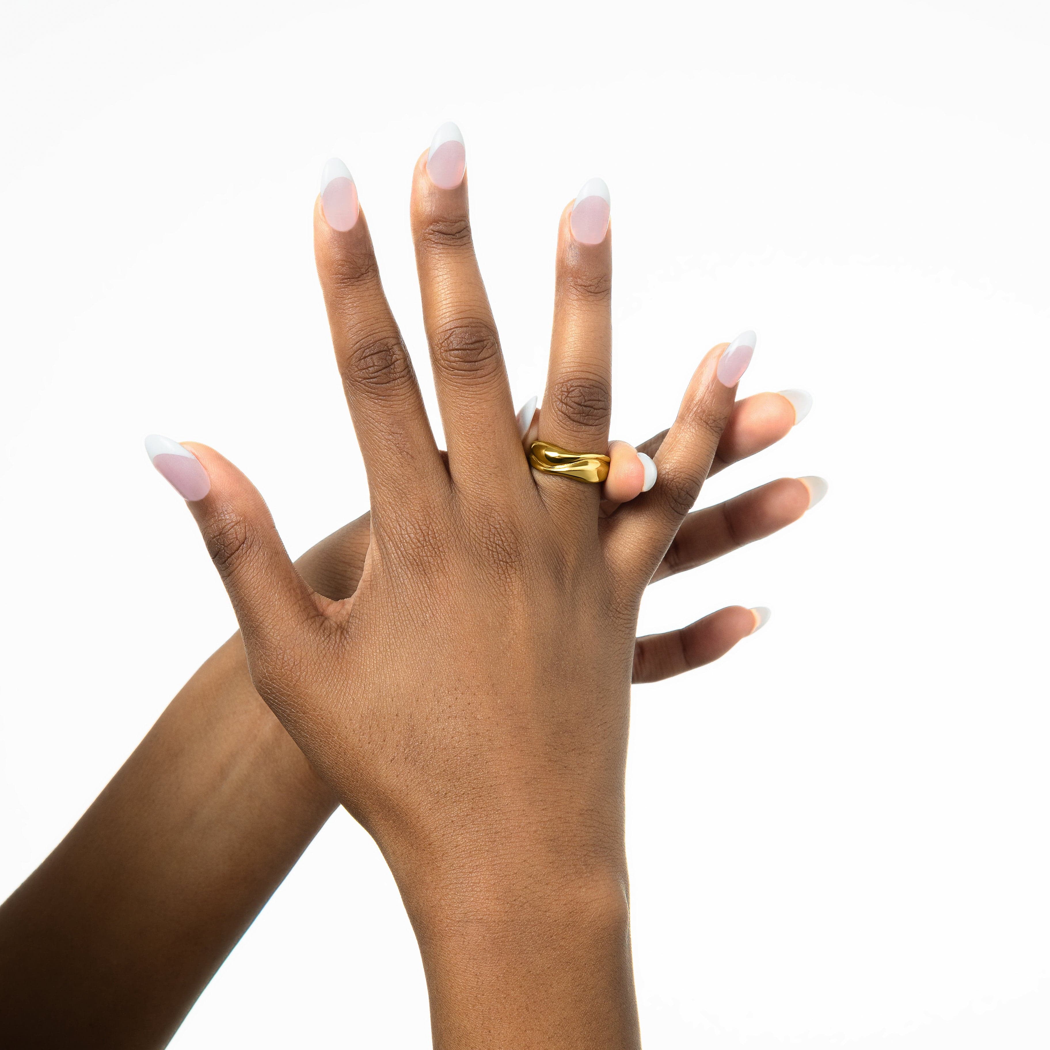Close-up of the Fluid Harmony Stackable Rings intricate details and 18K gold plating.