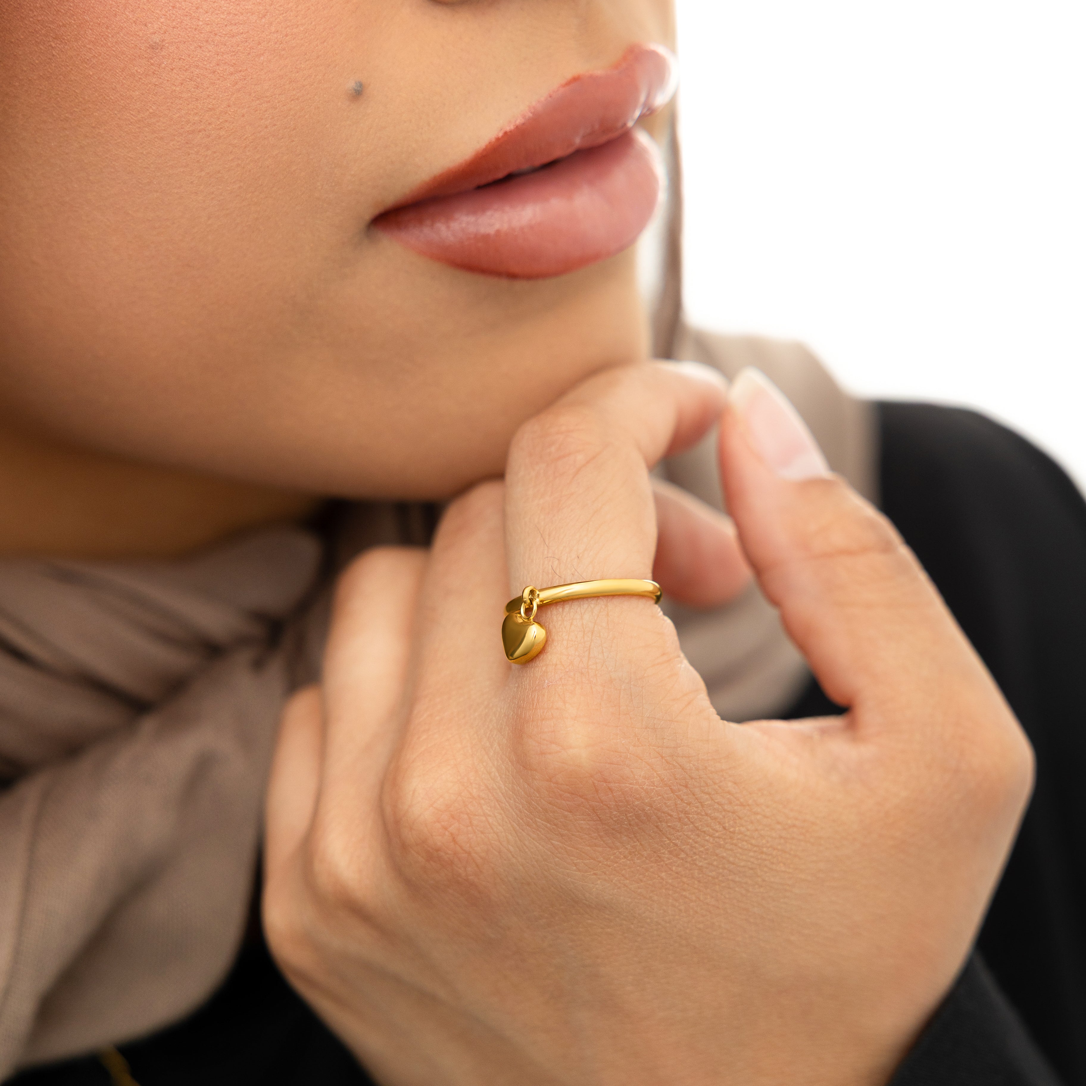 Elegant Gold Heart Loop Ring in its velvet pouch, ideal for gifting.