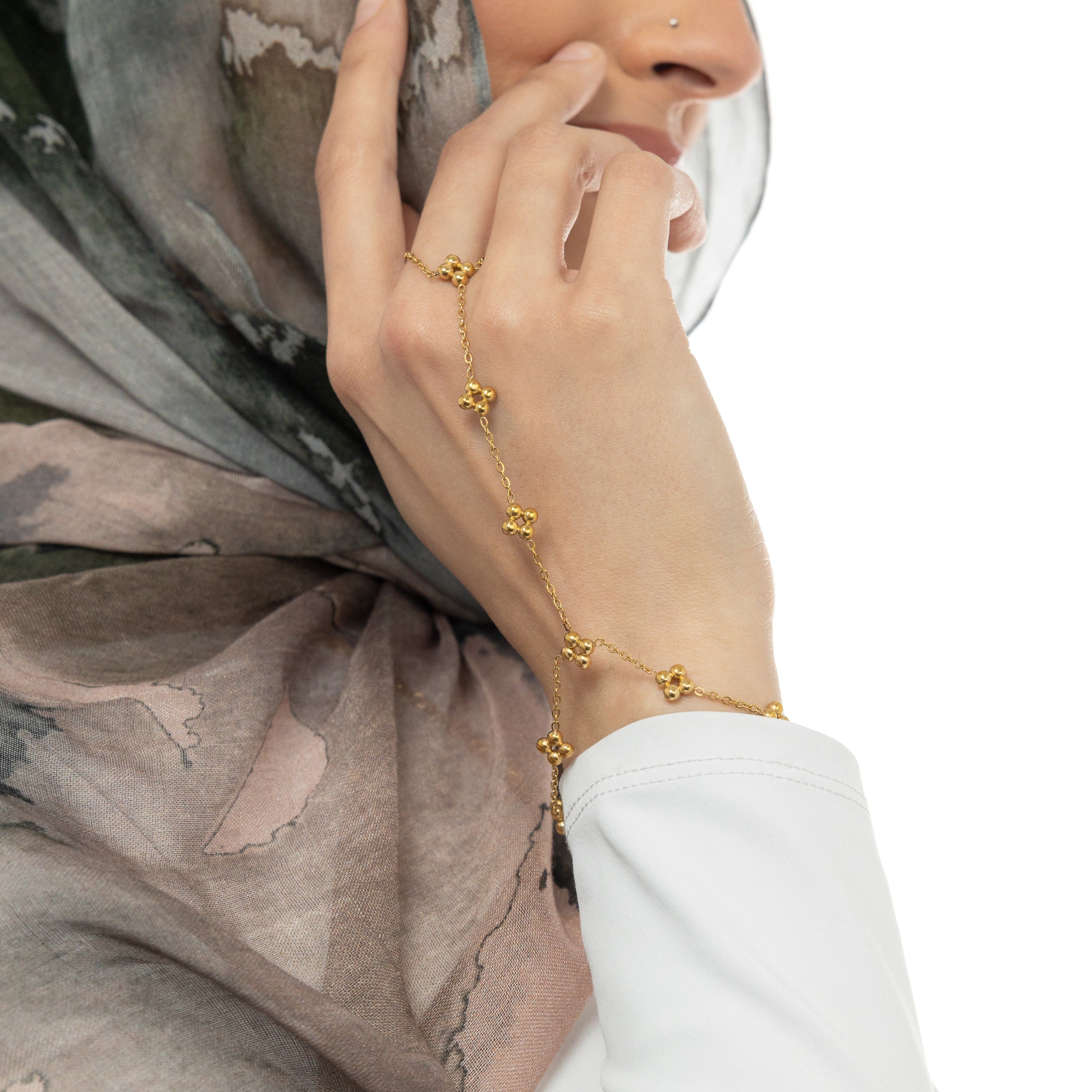 Worn view of the henna hand chain on a wrist, demonstrating its elegance.