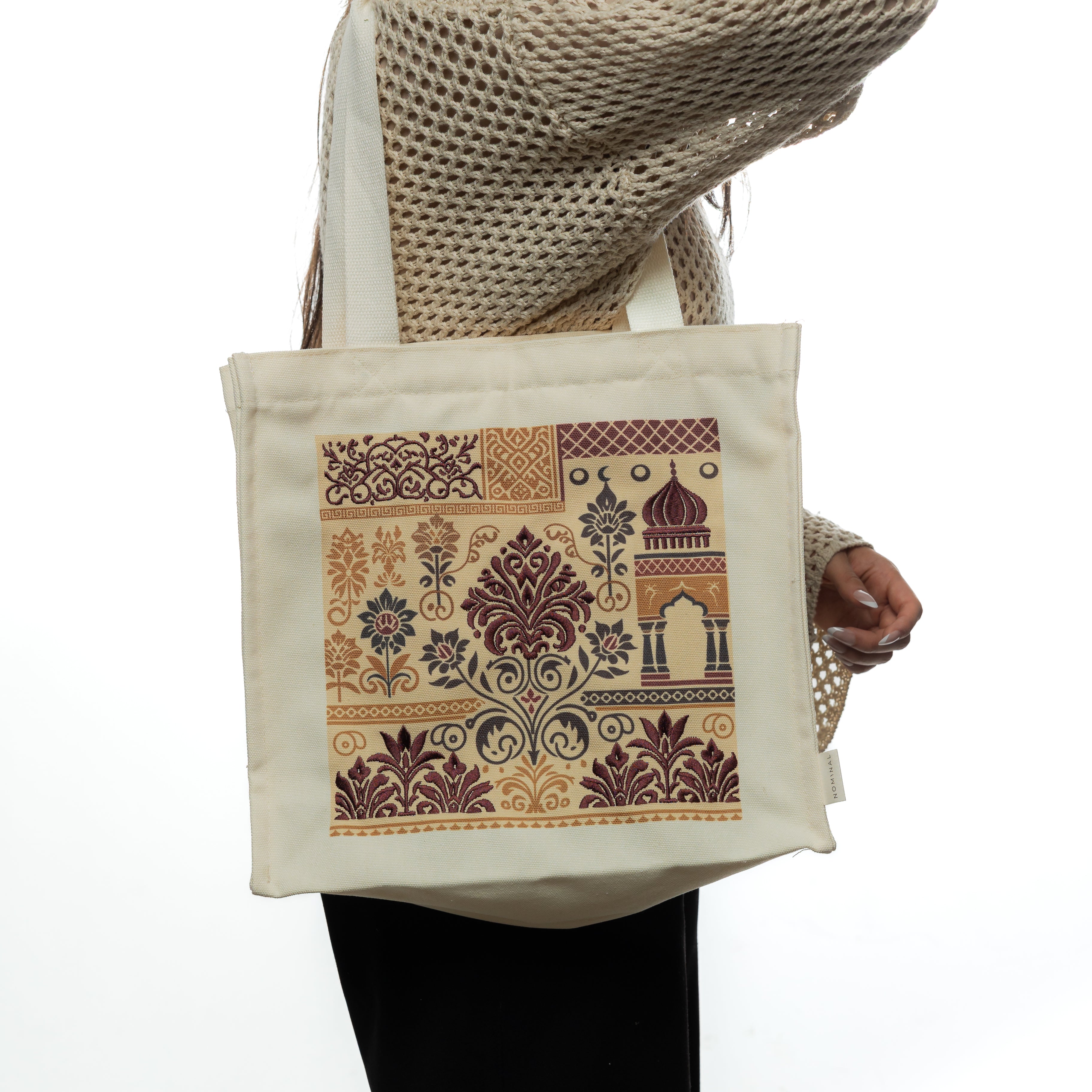 Close-up of the embroidered details on the textured cotton tote.