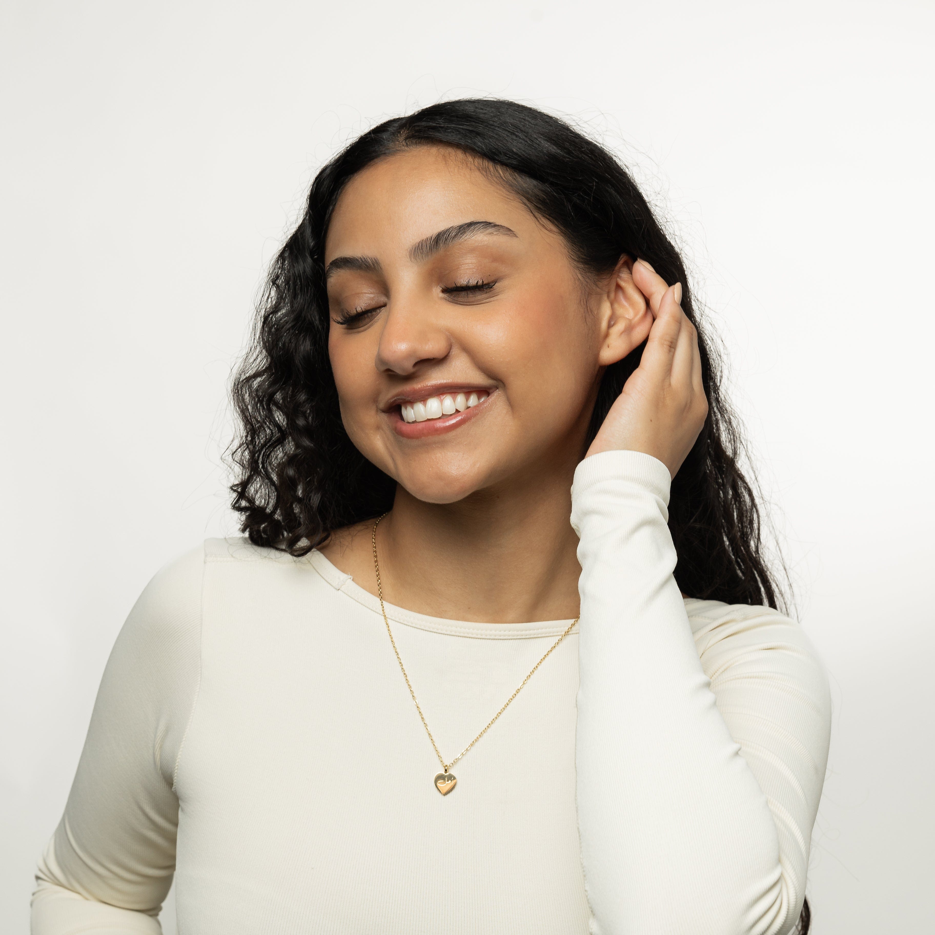 Hope charm necklace worn as a gift, showing the elegant design and gold pendant.