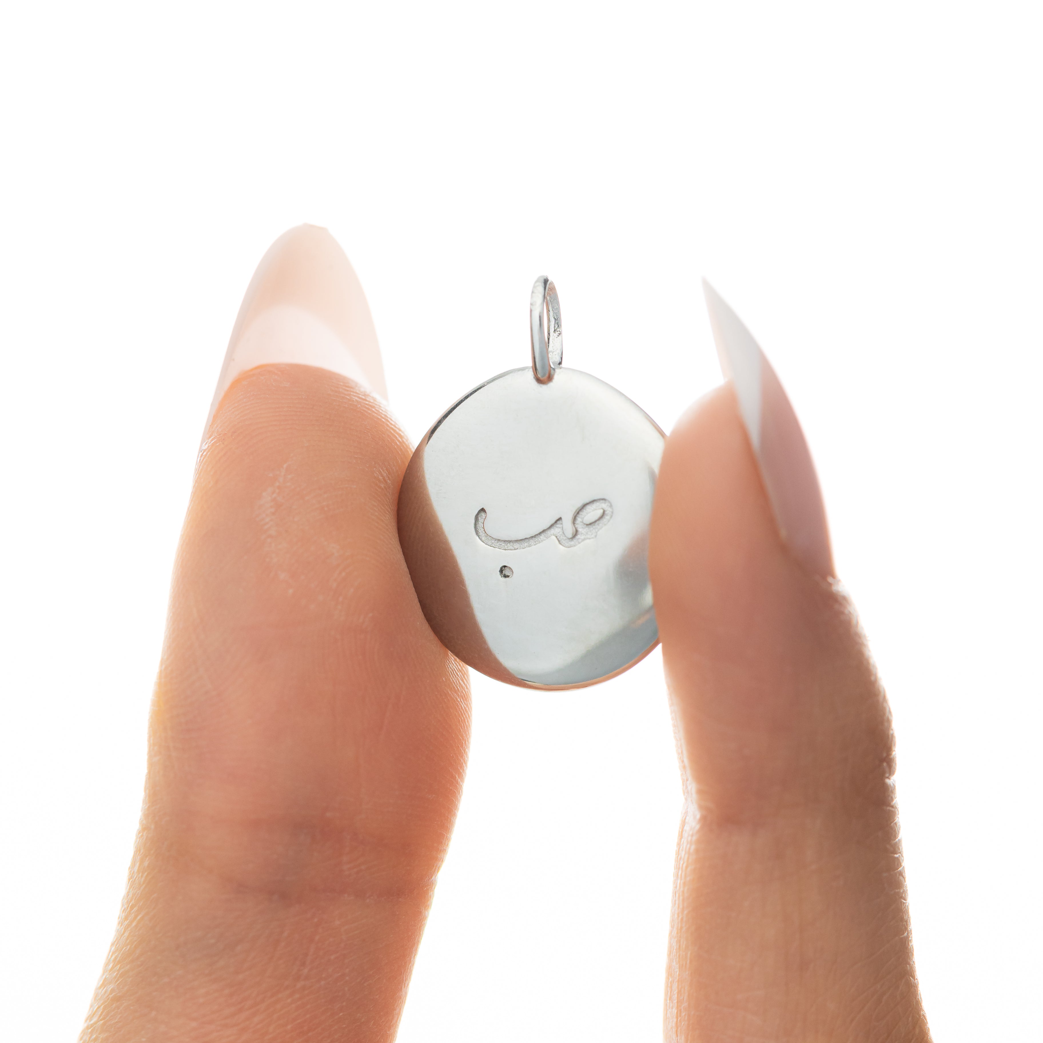 Close-up of the gold charm highlighting its hypoallergenic properties.