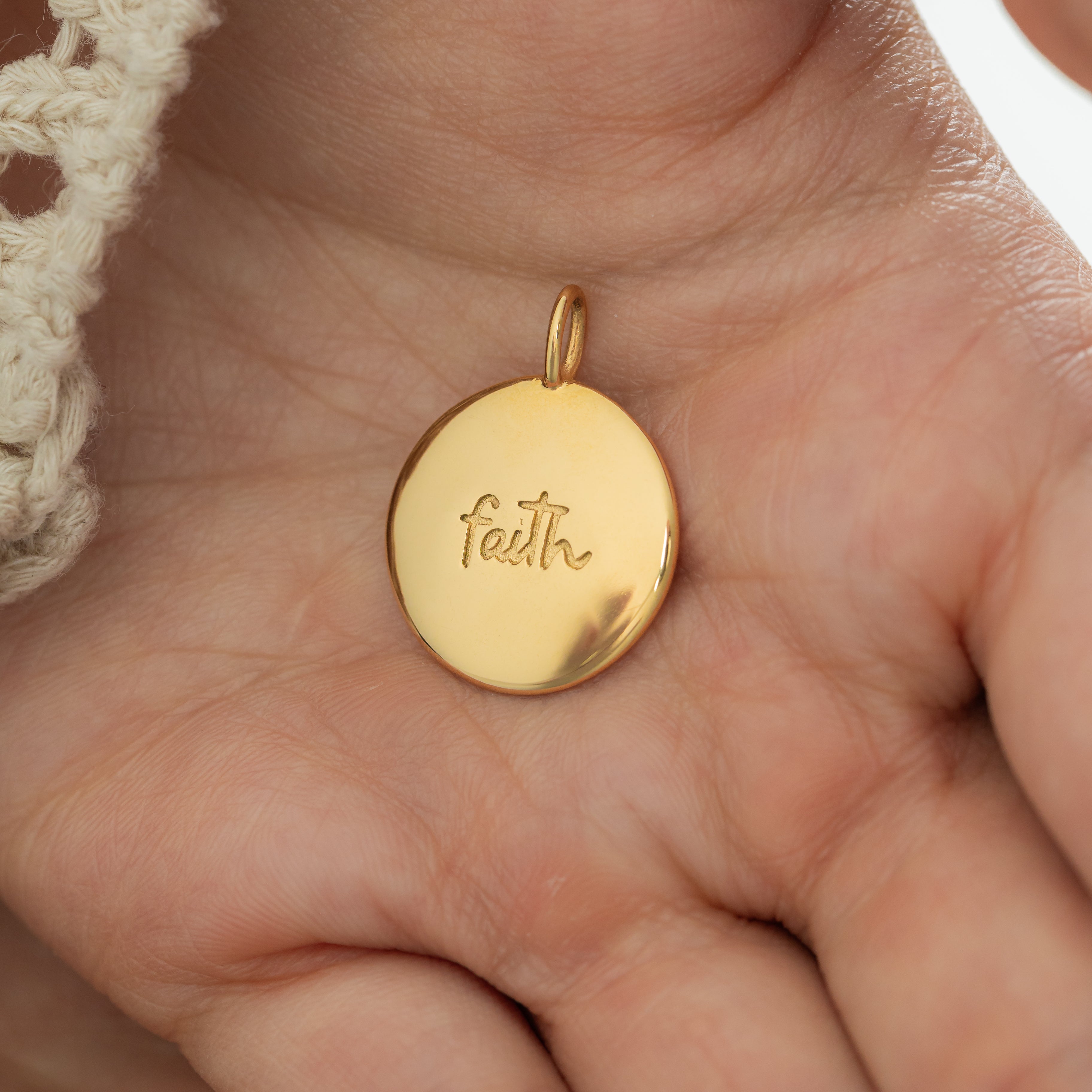 Packaging of the Iman Faith Charm in a stylish Nominal Velvet Pouch.