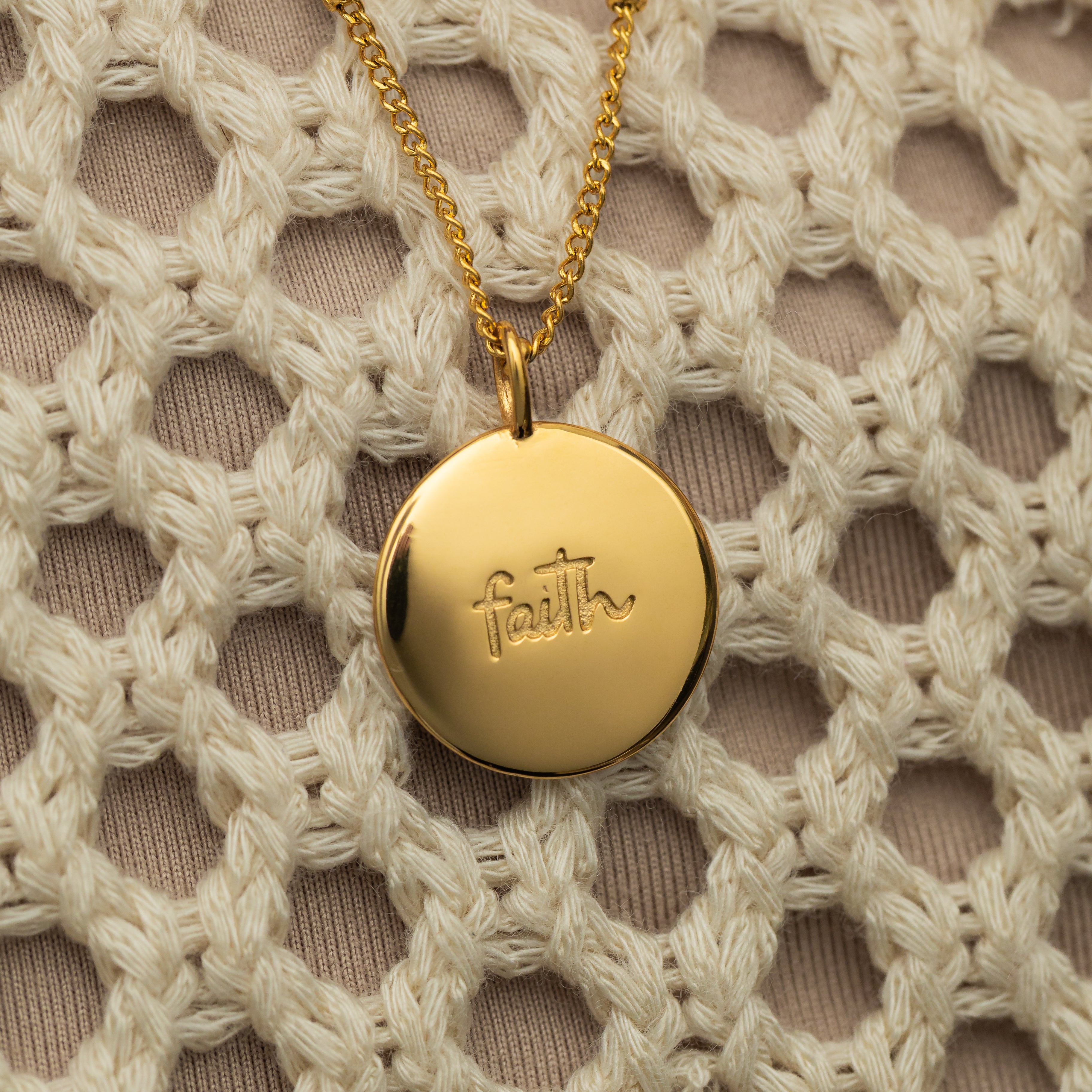 Packaging of the Iman Faith Charm in a stylish Nominal Velvet Pouch.