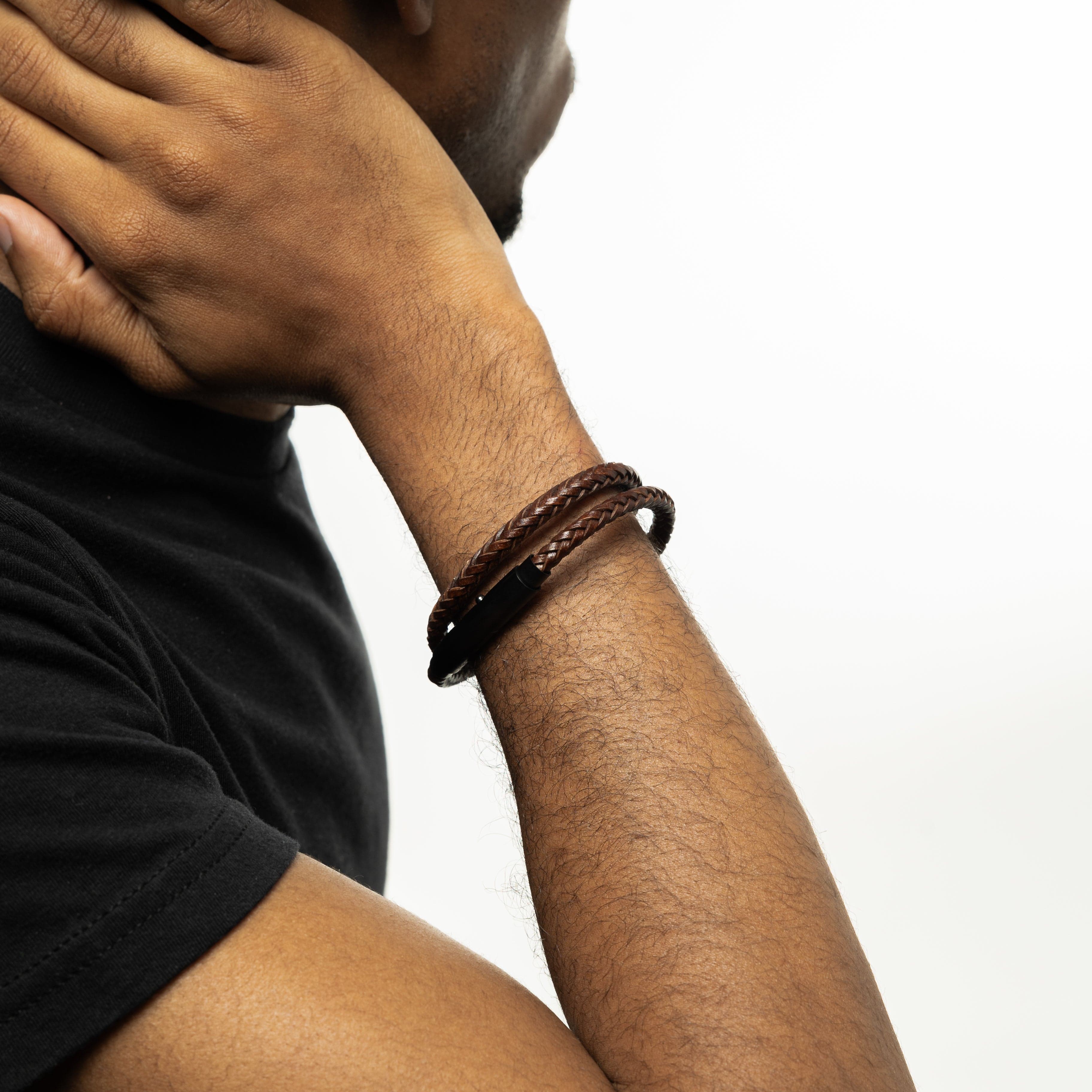 Eternal faux leather bracelet displayed on a wooden surface, highlighting its unique spiral design.