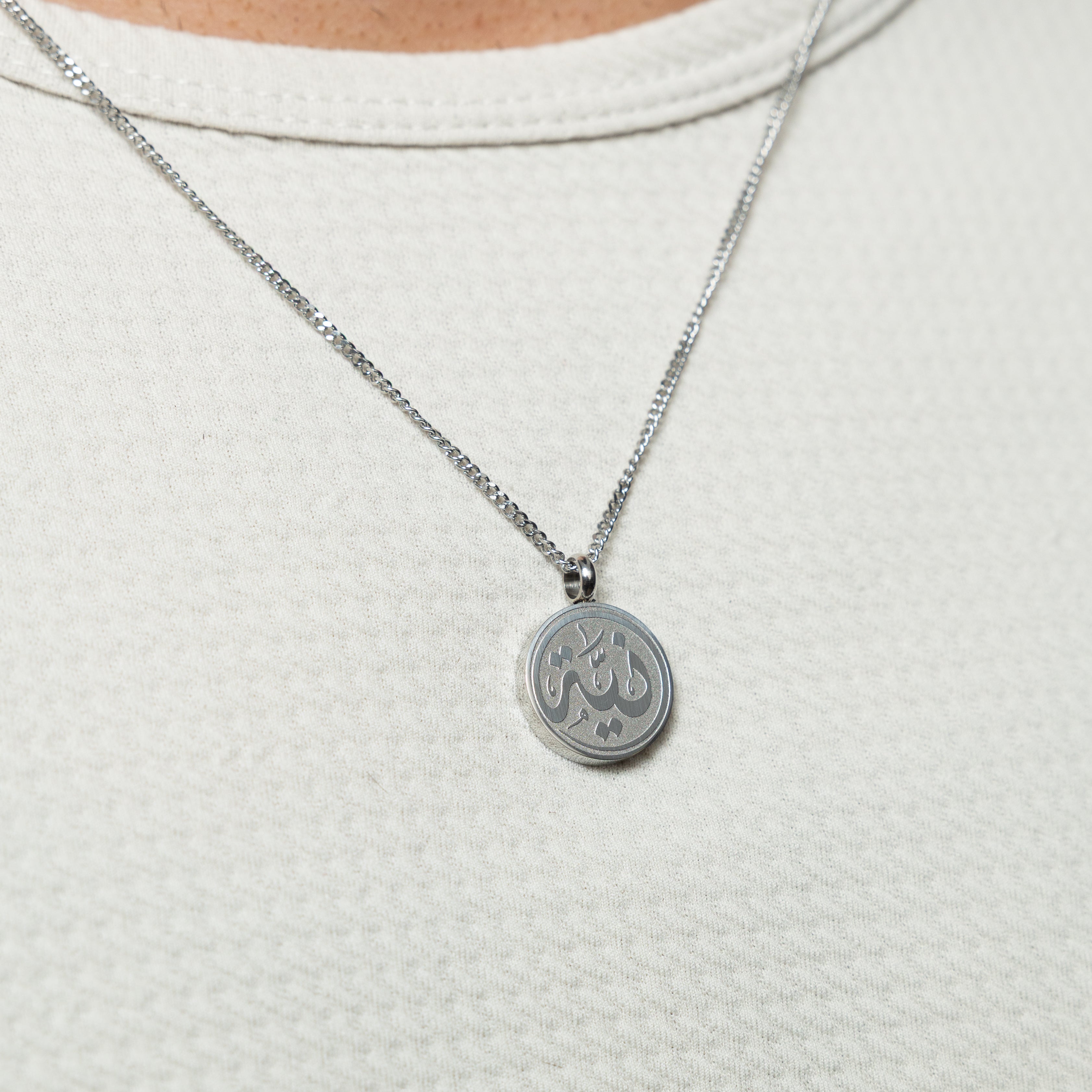 Model wearing hypoallergenic mens necklace with meaning outdoors