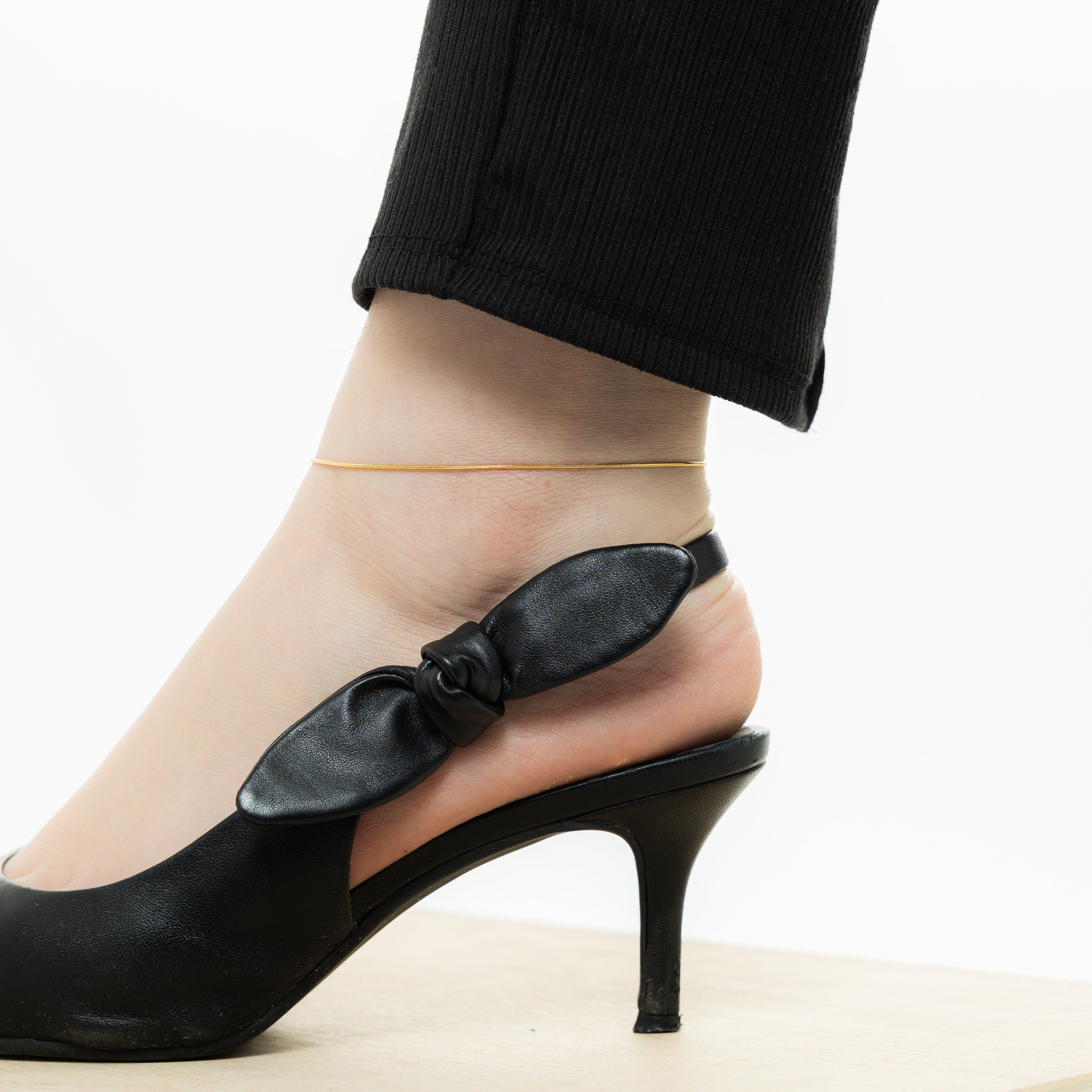 Elegant Harmony Gold Anklet elegantly packaged in a velvet pouch, ready for gifting.