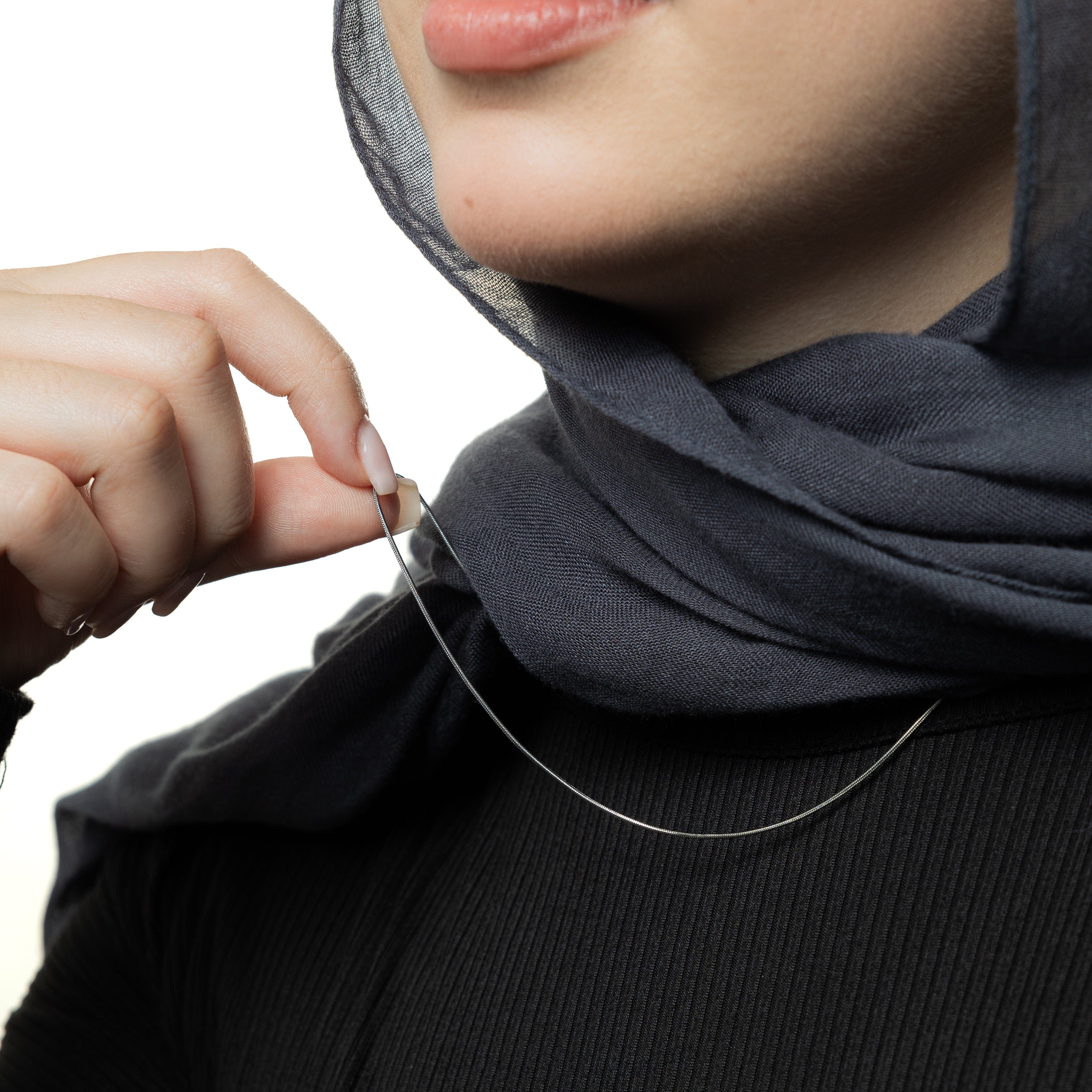 Model wearing the Invisible Elegance Gold Chain at 22 inches, demonstrating its versatile styling options.