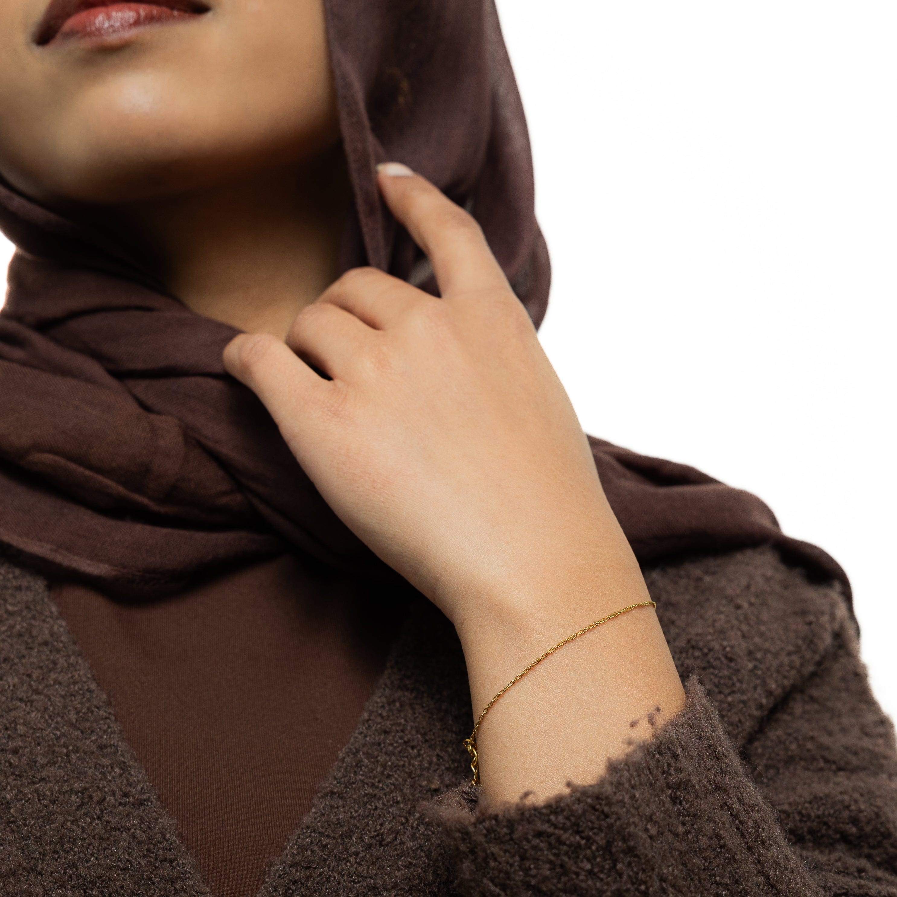 Close-up of the gold bracelet highlighting its hypoallergenic features.