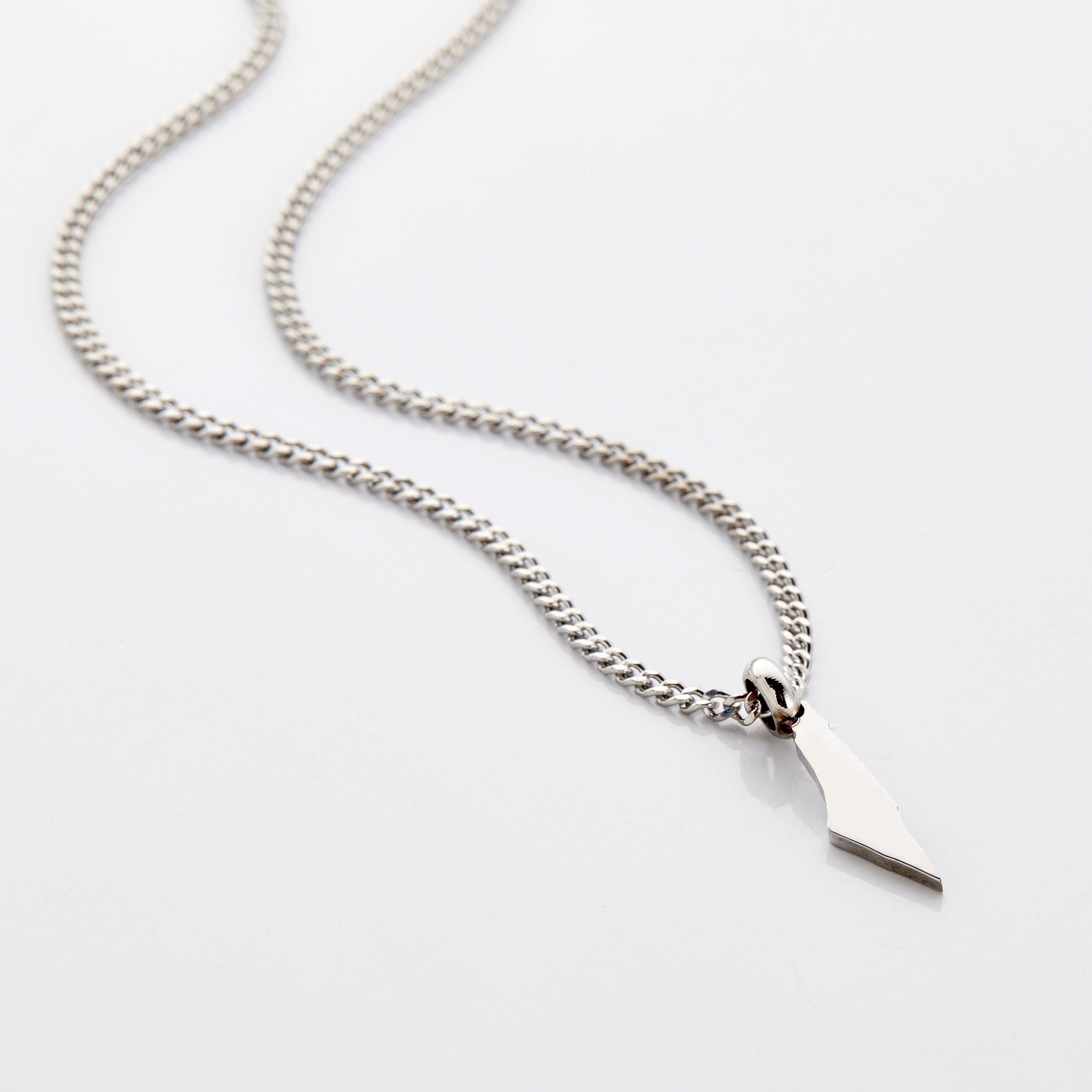 Kids wearing personalized necklaces, showing off their unique hometowns