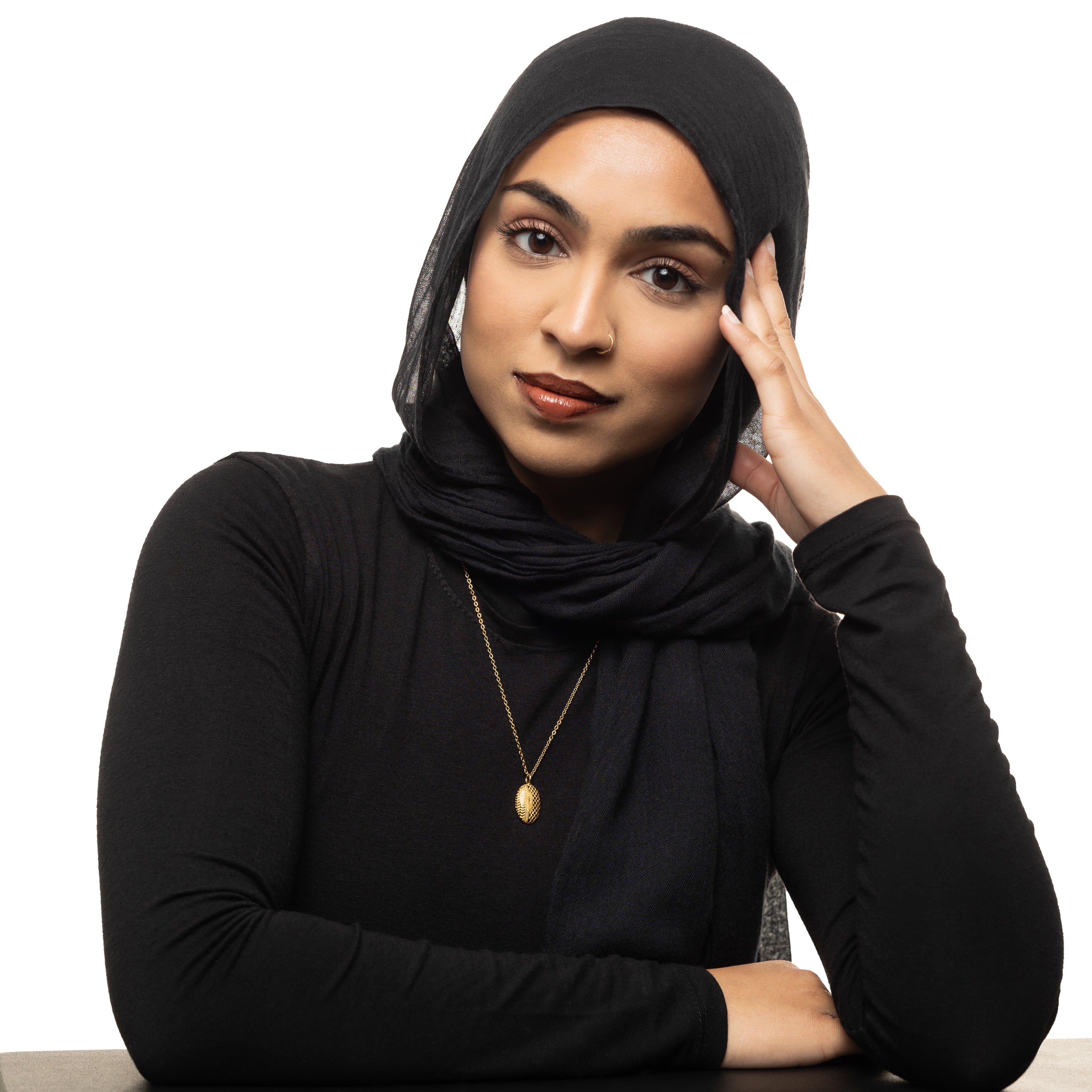 Full-length shot of womens jewelry styled with the 22-inch keffiyeh necklace