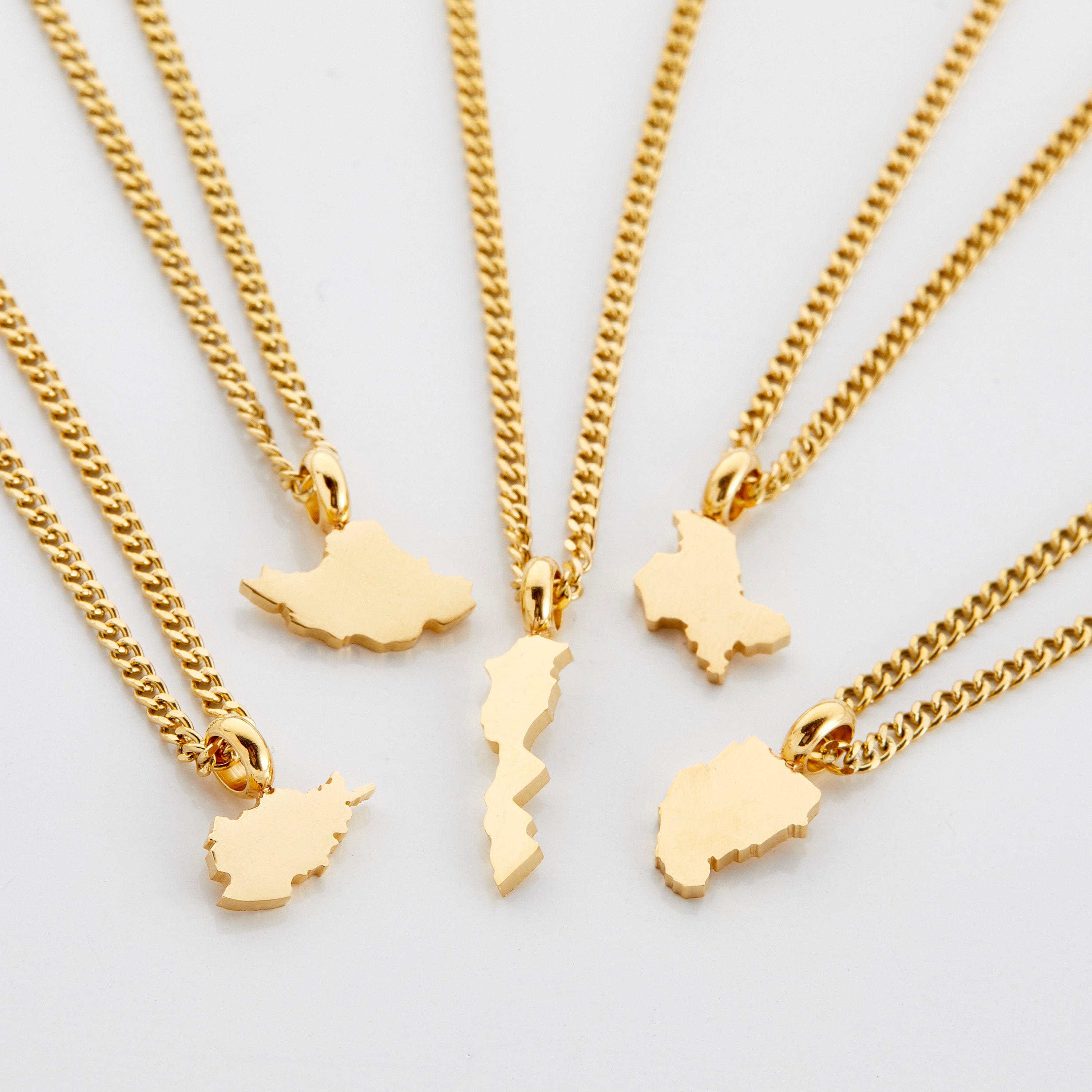 Kids wearing personalized necklaces, showing off their unique hometowns