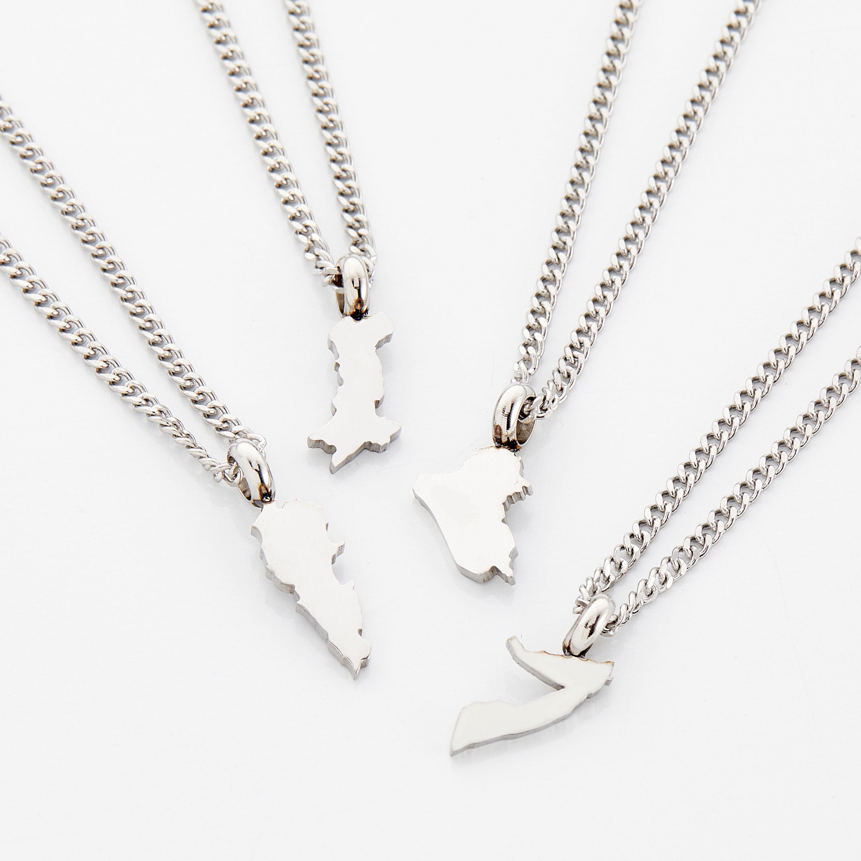 Close-up of a custom gold necklace for kids featuring a hometown map