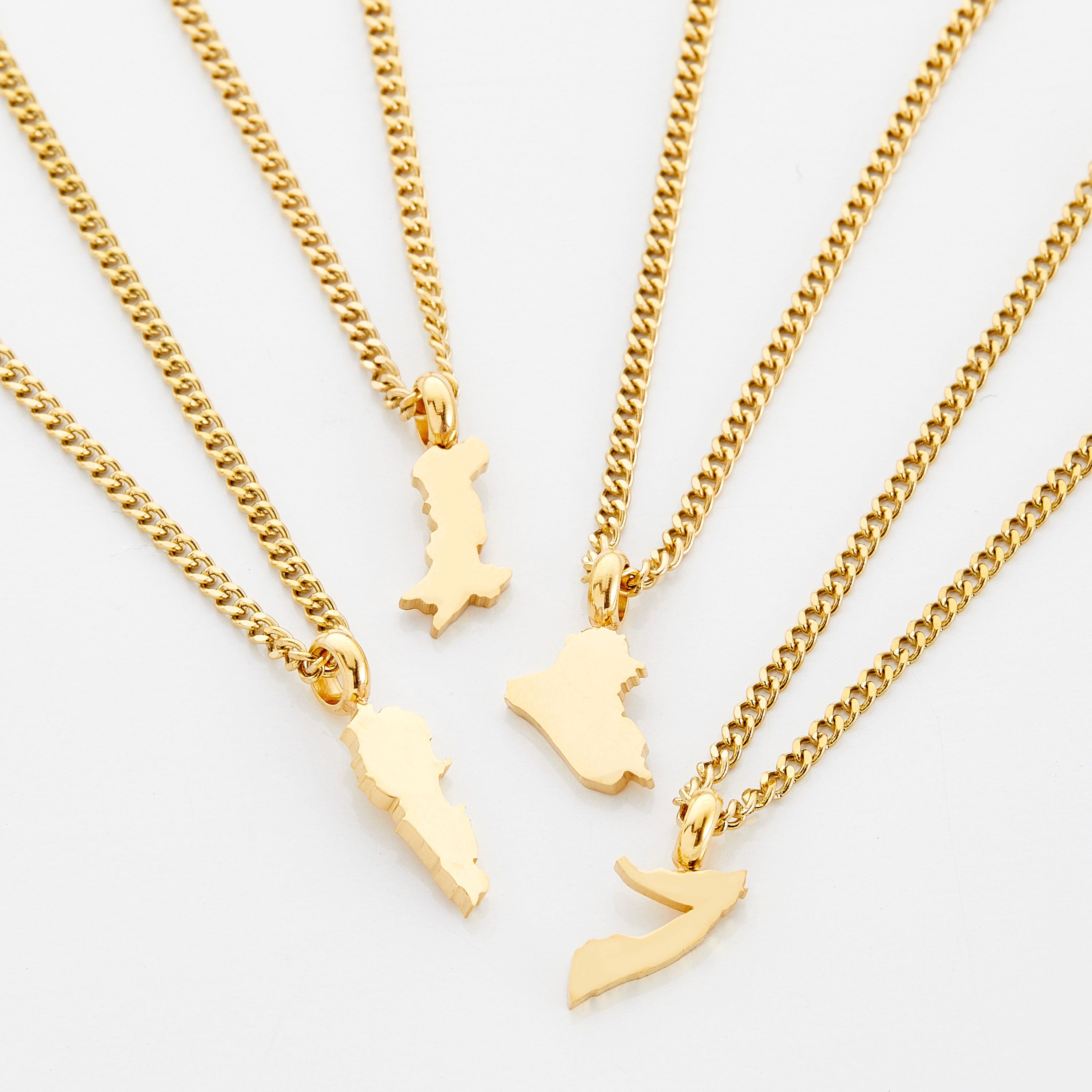Close-up of a custom gold necklace for kids featuring a hometown map