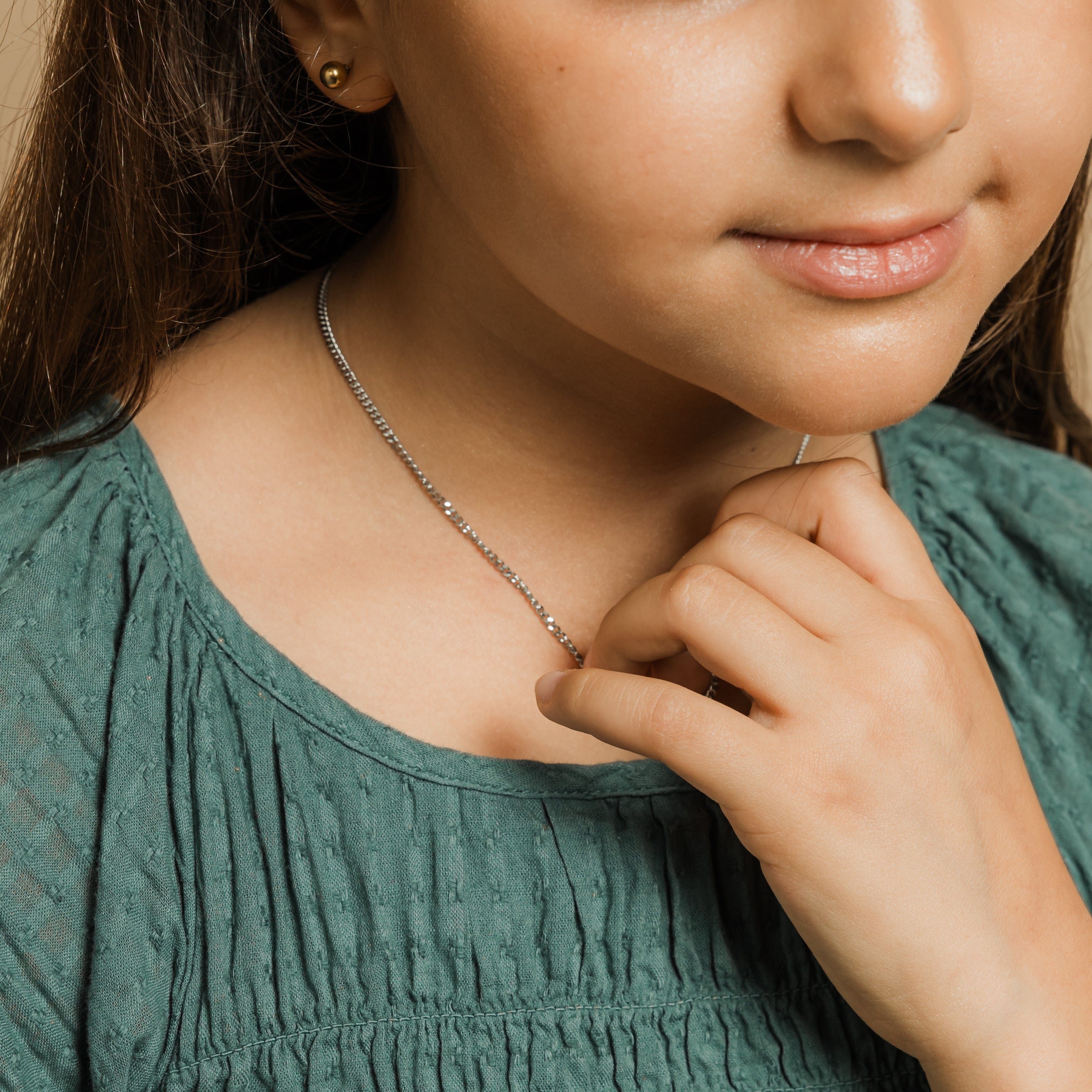 Elegant presentation of the gold necklace in a velvet drawstring pouch.