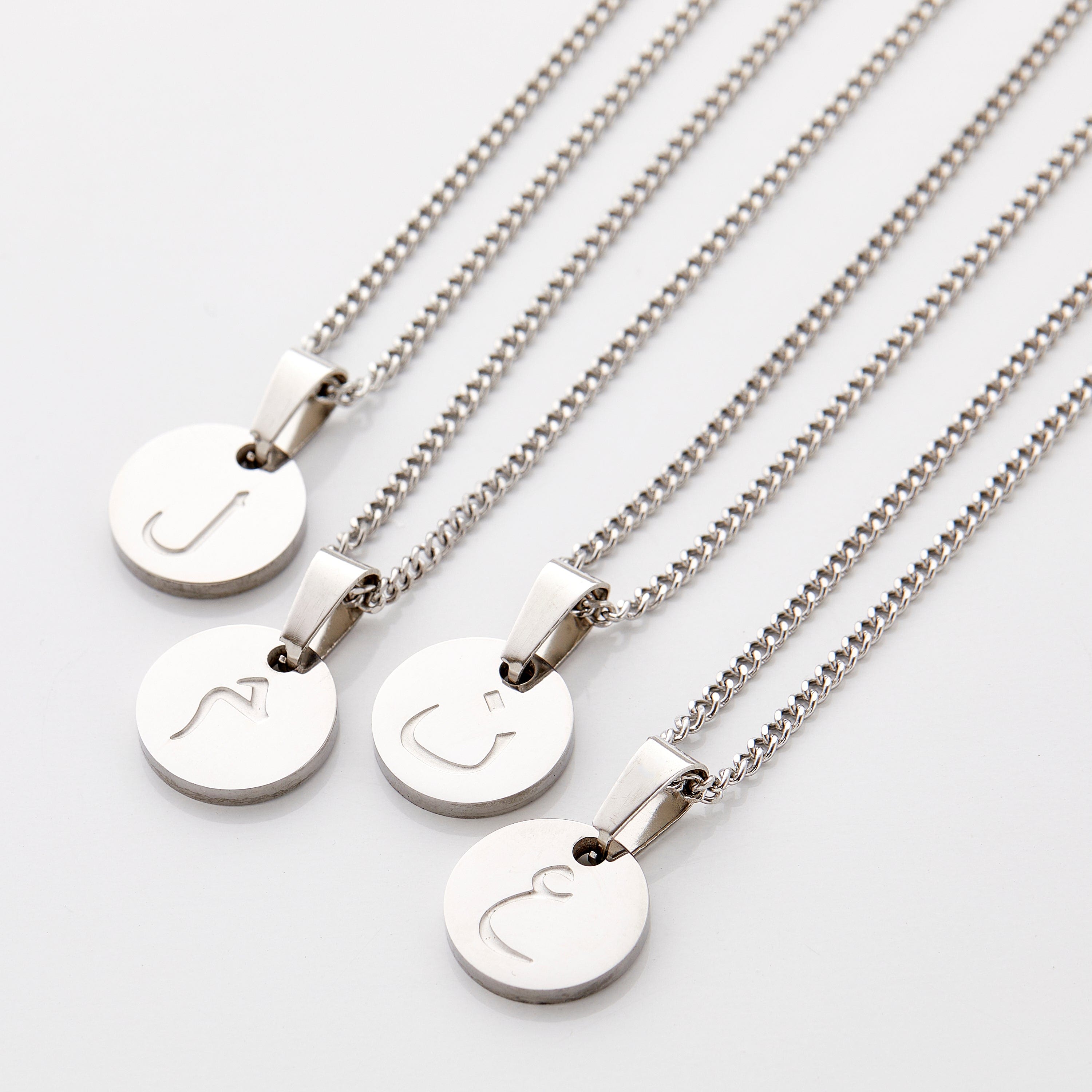 Close-up of the personalized Arabic letter necklace showcasing its fine details and craftsmanship.