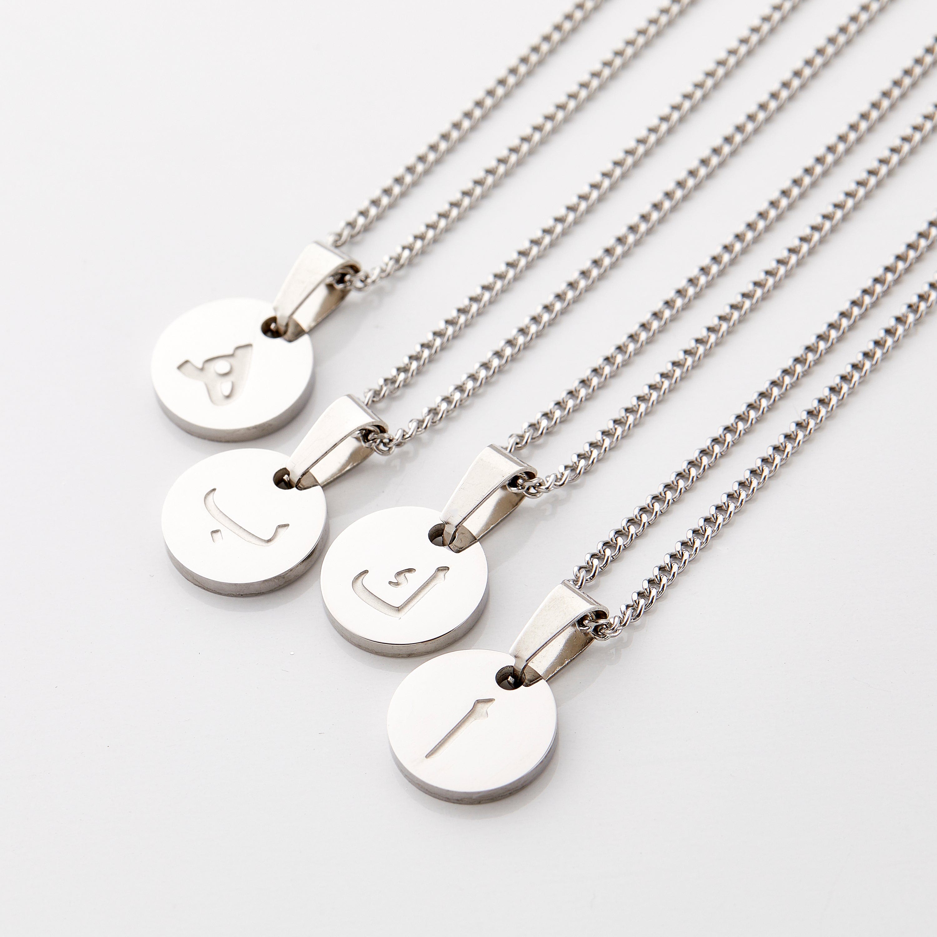 Close-up of the personalized Arabic letter necklace showcasing its fine details and craftsmanship.