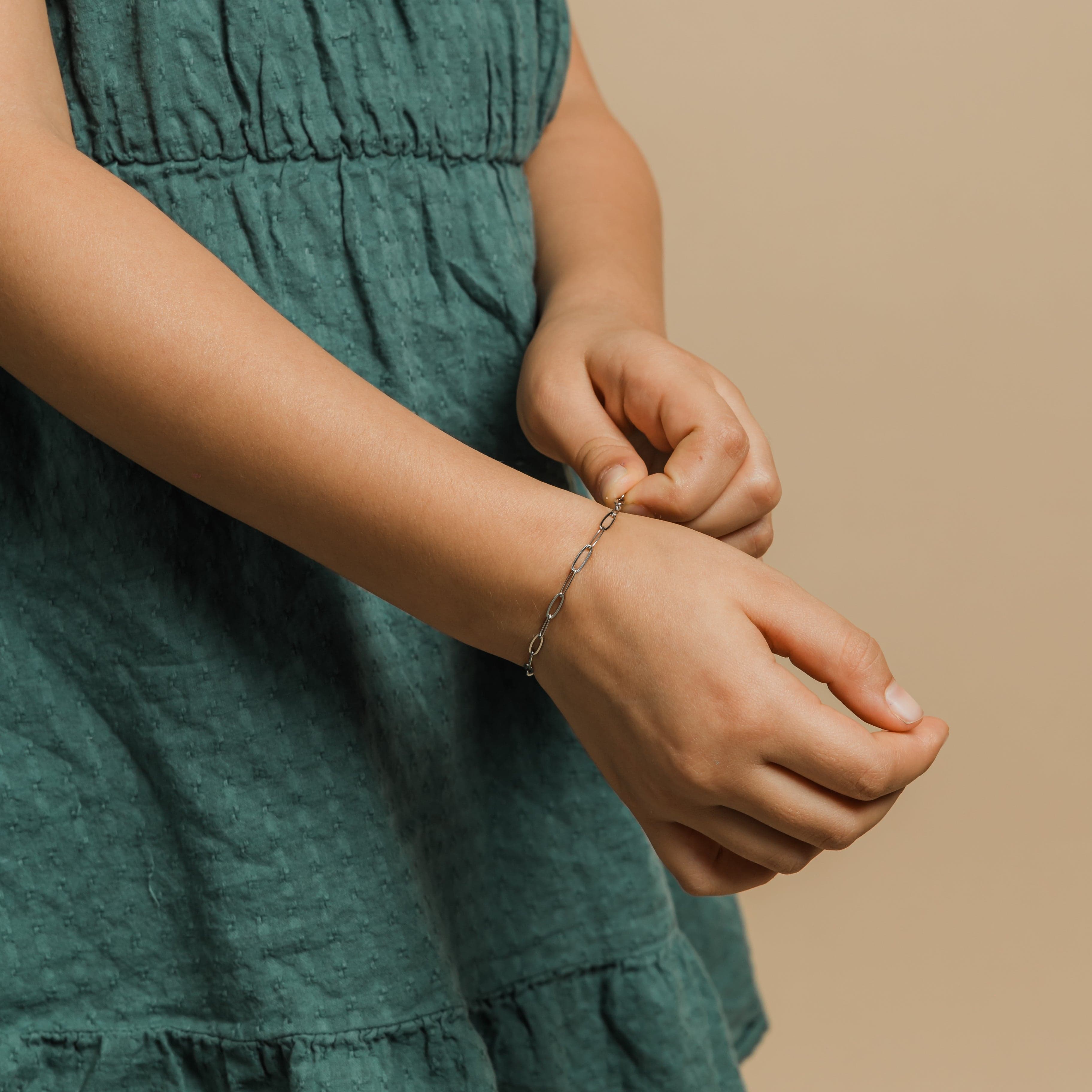Eternal Gold Link Chain Bracelet displayed on a wrist, highlighting its waterproof feature.