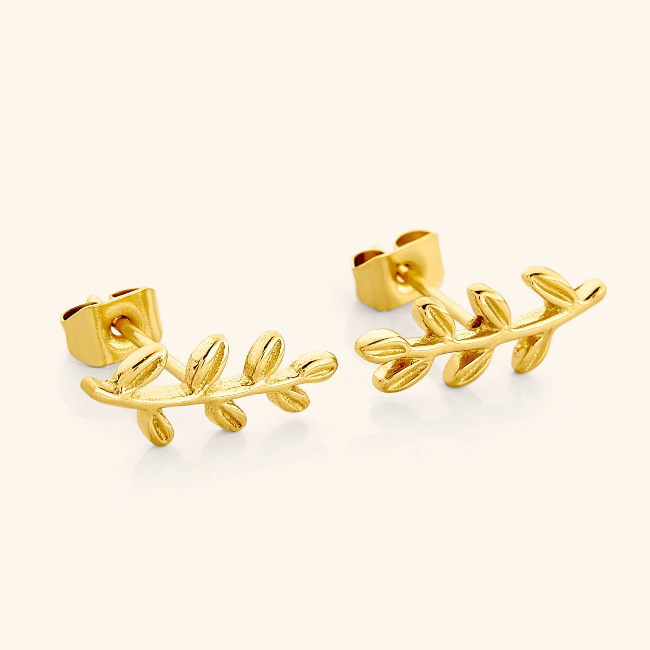 Close-up view of olive leaf minimalist earrings showcasing their elegant design.