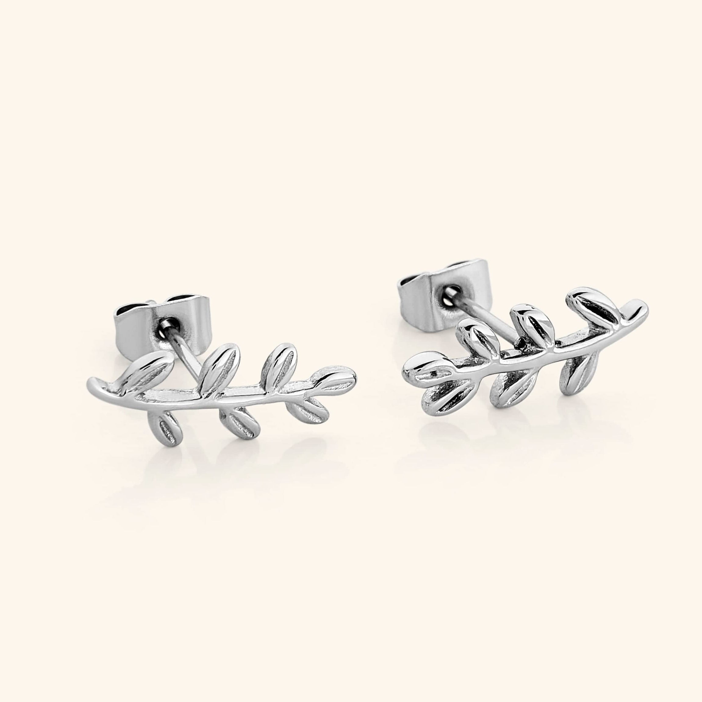 Olive leaf earrings displayed in a velvet pouch, emphasizing their gift-ready packaging.